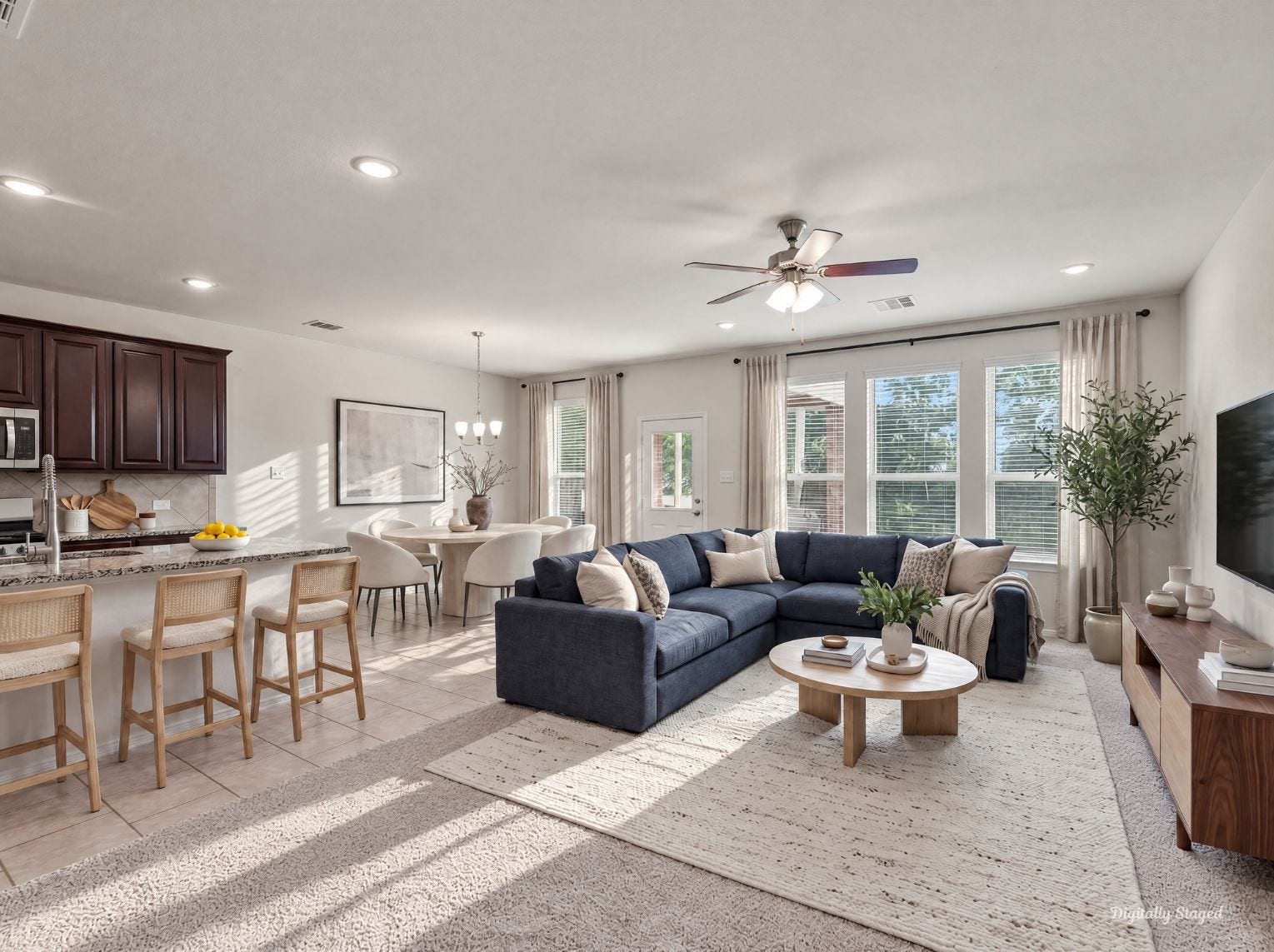 230 Elianne Lace Court, Conroe, TX 77318 Open-concept main living area connecting the kitchen, dining space, and living room under recessed lighting and a ceiling fan. A wall of windows fills the space with natural light and easy backyard views.
This photo has been digitally staged to illustrate the possibilities of the homes aesthetic and potential design. Some furnishings and dcor shown are for visual inspiration.