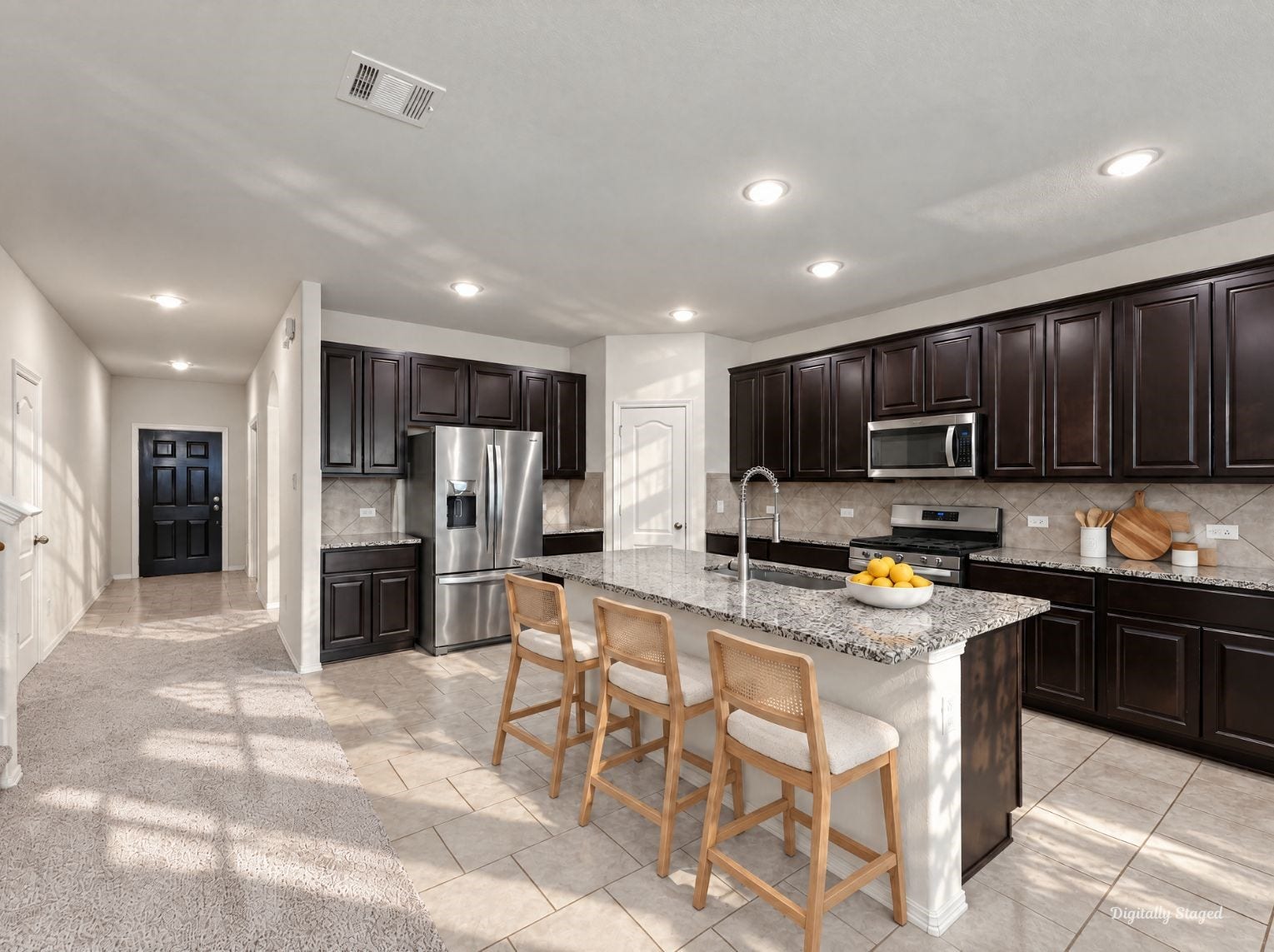 230 Elianne Lace Court, Conroe, TX 77318 Kitchen with abundant dark raised-panel cabinetry, recessed lighting, and ample granite counter space. The large island anchors the room and keeps the layout open and functional.
This photo has been digitally staged to illustrate the possibilities of the homes aesthetic and potential design. Some furnishings and dcor shown are for visual inspiration.