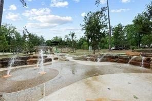 230 Elianne Lace Court, Conroe, TX 77318 The community's extensive amenities include a
modern splash pad and water feature area, perfect
for cooling off during the summer months.
Surrounded by mature trees and natural stone
accents, this park-like setting provides endless
outdoor entertainment for residents.