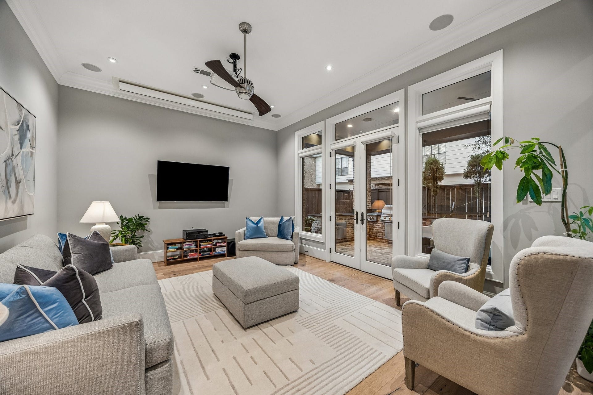 Family Room for casual entertaining with LED recessed lighting, Ceiling Mounted Projector and Screen built-in speakers, wide plank floors, crown molding and 8 Inch baseboards.