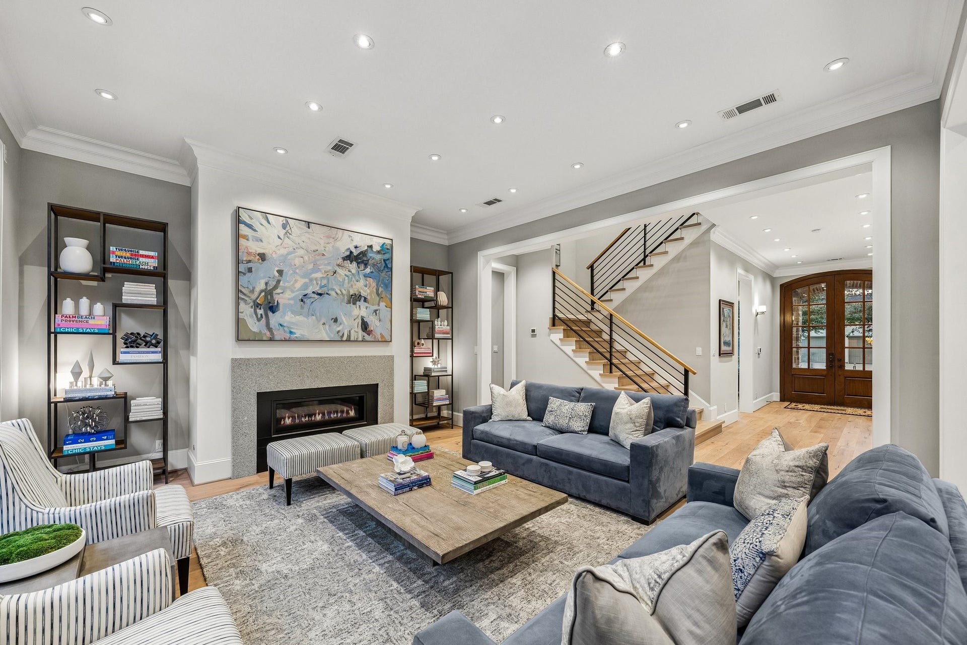 The spacious, open-concept design creates a seamless connection between the main living area and the impressive entry foyer, offering an inviting atmosphere ideal for both everyday living and elegant entertaining.