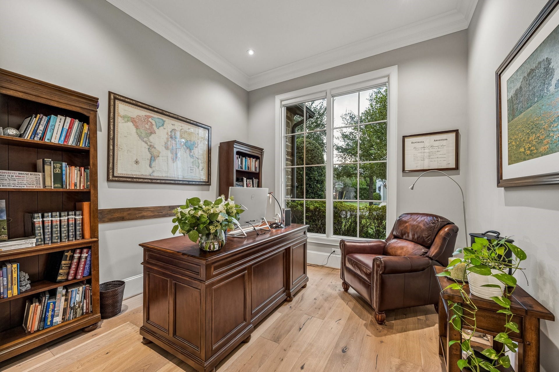 The study is located off the stunning entry foyer. This room features, LED recessed lighting, wide plank floors, crown molding and 8 Inch baseboards.  A magnificent oversized picture window with divided-light detailing provides picturesque views of the lush, beautifully landscaped grounds while allowing an abundance of natural light to illuminate the room.