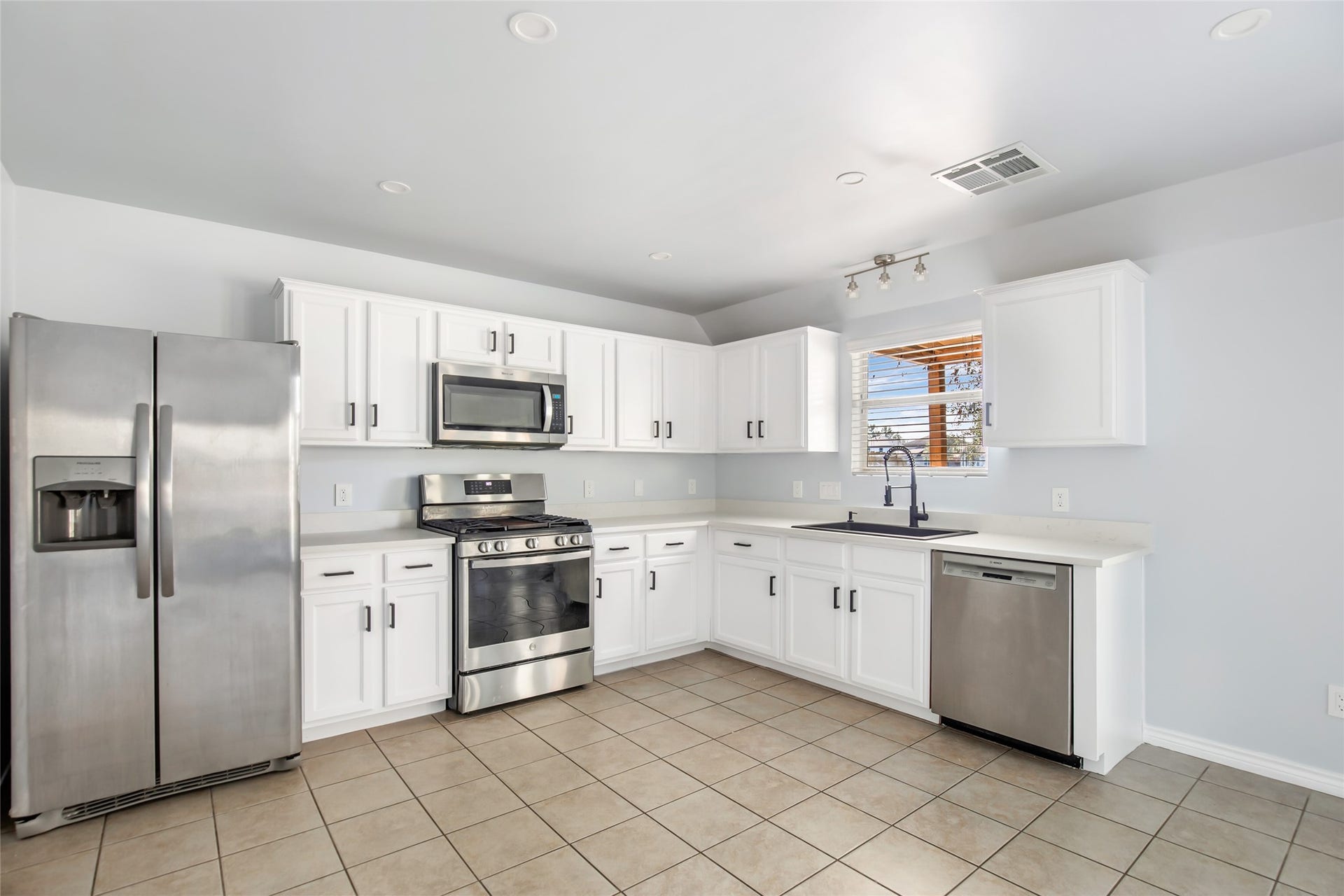 639 Trail Springs Court, Kingwood, TX 77339 Stainless steel appliances, updated cabinetry hardware w/ soft close hinges, and updated paint on cabinets