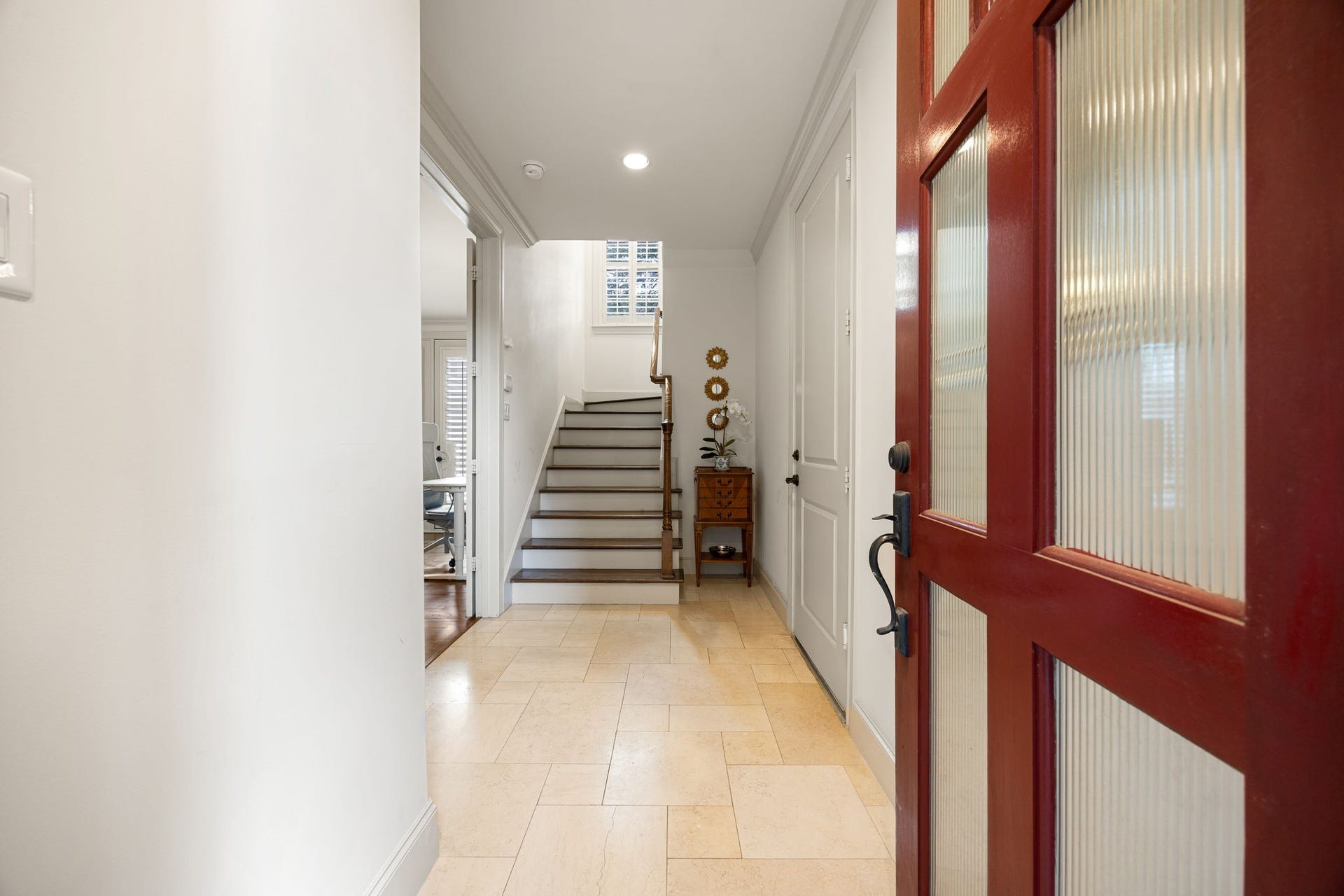 310 W Bell Street, Houston, TX 77019 Upon entering the home, you will notice one of the secondary bedrooms and the garage entry. The space is light and open and the staircase leads you to the main living floor.