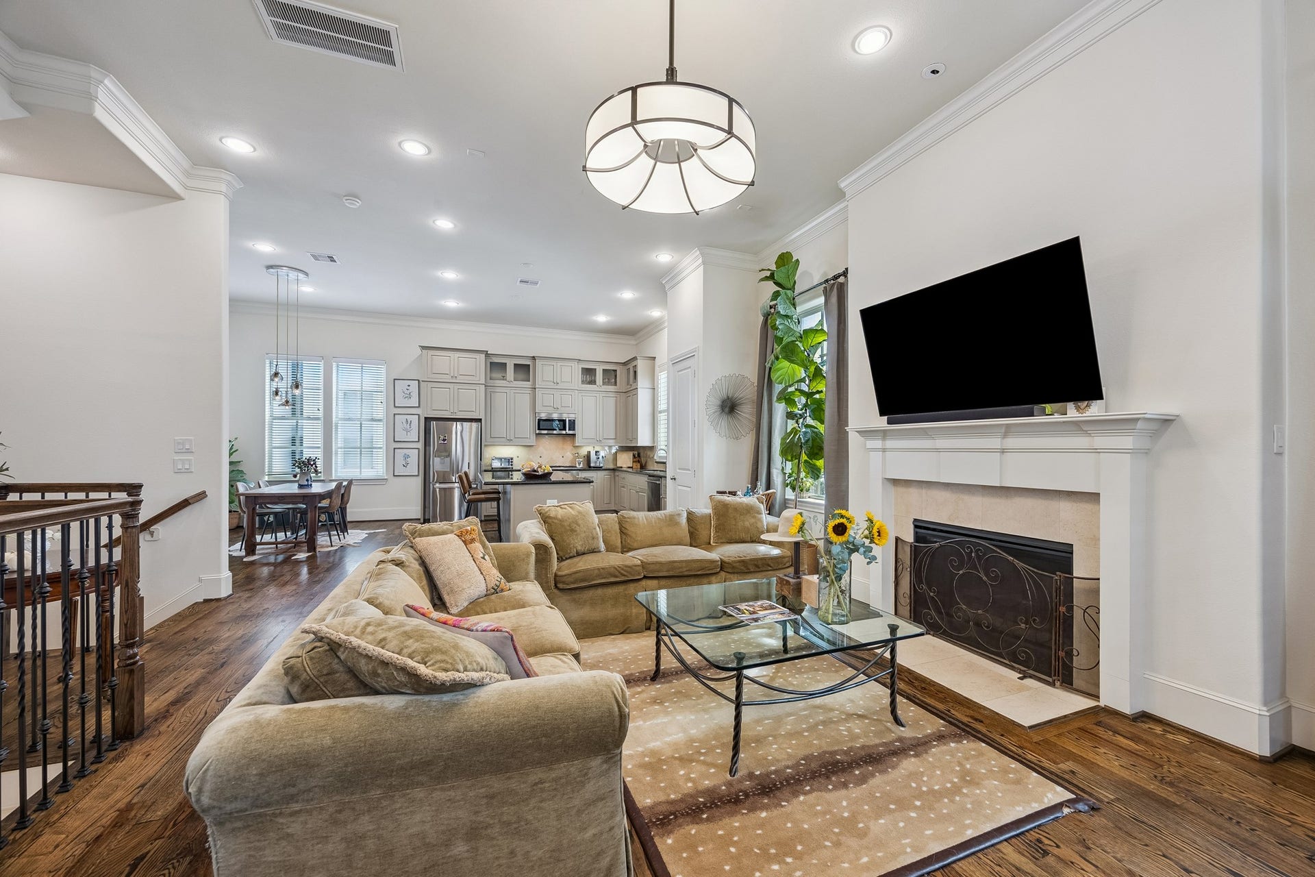2721 Cohn Street, Houston, TX 77007 Another perspective highlights the open flow of the second floor, w/recessed lighting throughout & the fireplace anchoring the living area as it connects effortlessly to the kitchen & dining space.