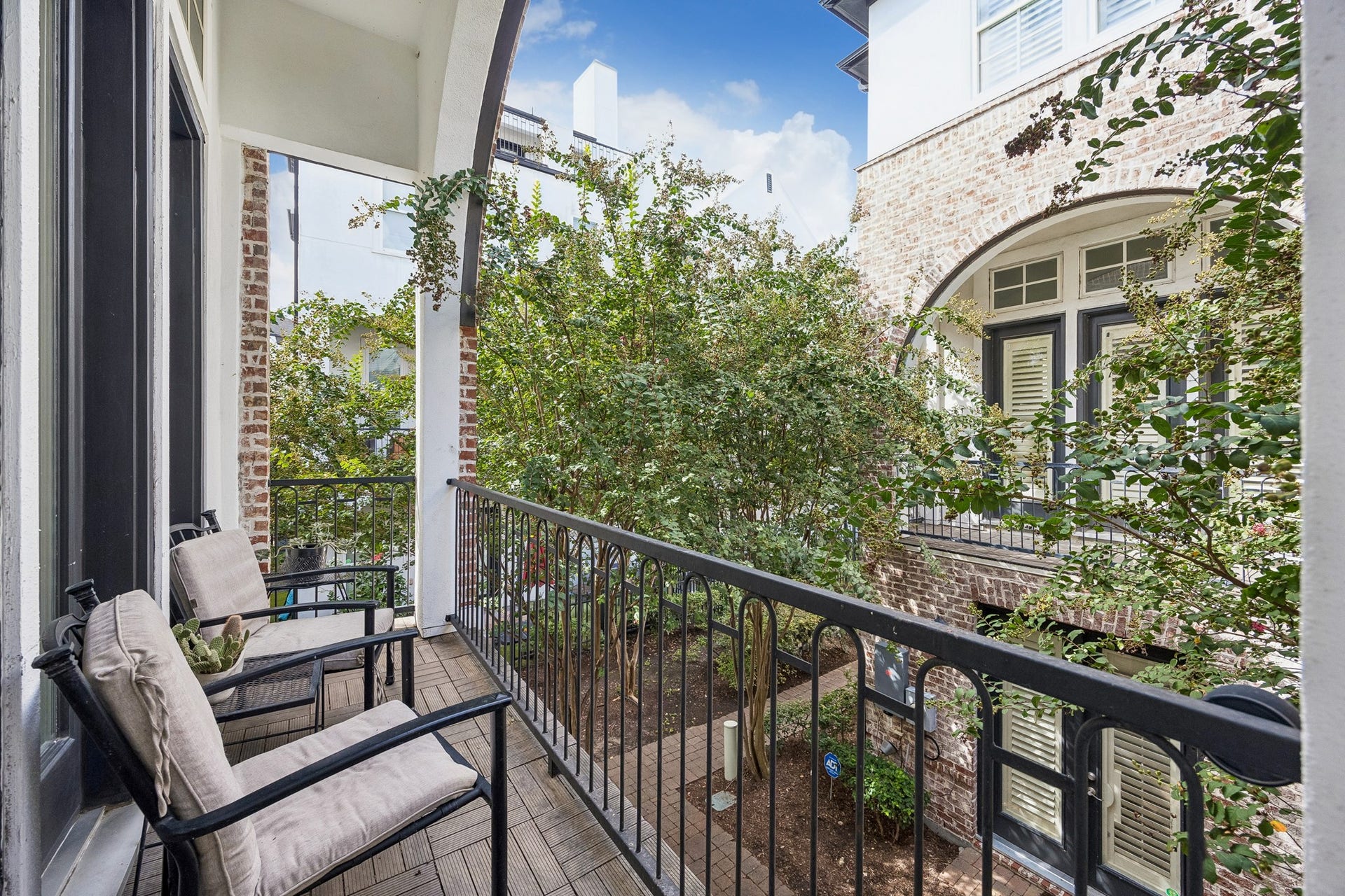 2721 Cohn Street, Houston, TX 77007 Balcony located just off the second-floor living area offers a relaxing outdoor extension of the home overlooking the communitys lush, tree-lined setting.