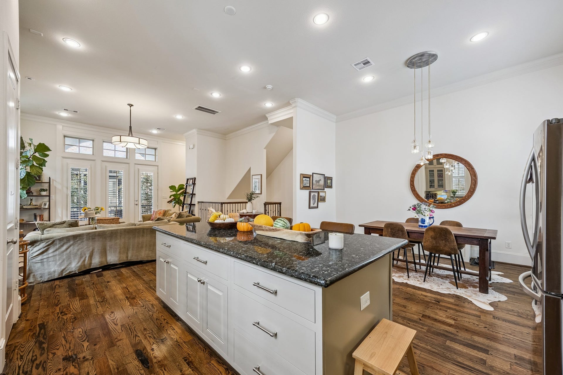 2721 Cohn Street, Houston, TX 77007 The oversized island anchors the kitchen while maintaining an easy flow to the dining & living areasideal for entertaining while keeping each space connected.
