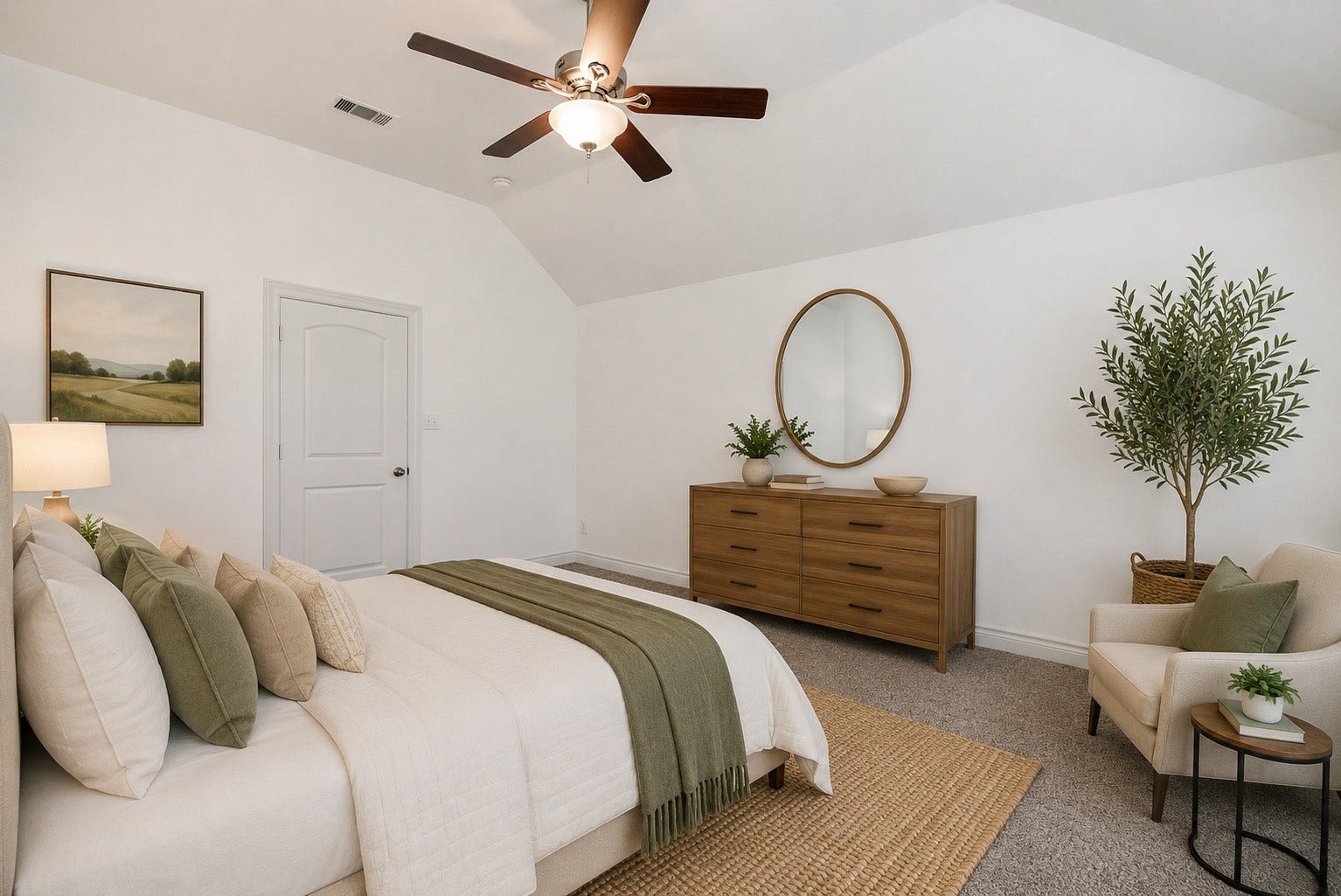Another angle of the spacious primary suite offers a peaceful retreat with soaring ceilings, abundant natural light, and ample space for a complete king-size furniture arrangement. Large windows create a bright, inviting atmosphere, while the private en-suite bath features dual vanities, a soaking tub, a separate glass-enclosed shower, and a generous walk-in closet. Designed with comfort and functionality in mind, this owner's retreat provides the perfect space to unwind at the end of the day.