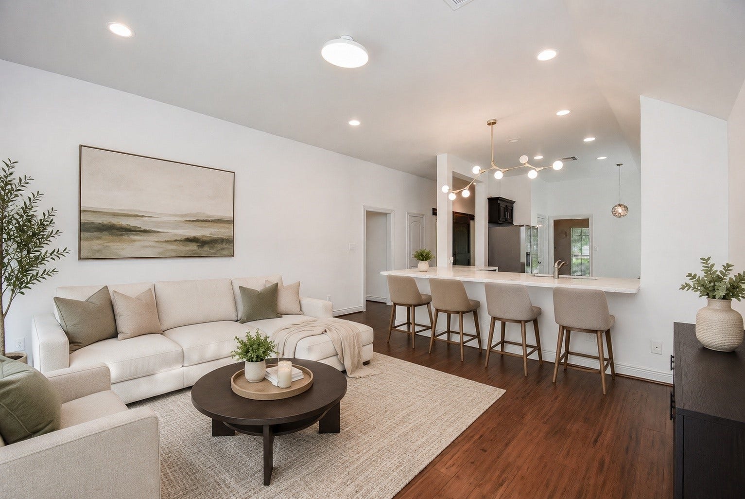 The heart of the home features a beautifully designed open-concept layout where the spacious family room flows effortlessly into the kitchen. An oversized quartz island with seating, elegant finishes, and abundant natural light create the perfect setting for everyday living and effortless entertaining. Virtually Staged