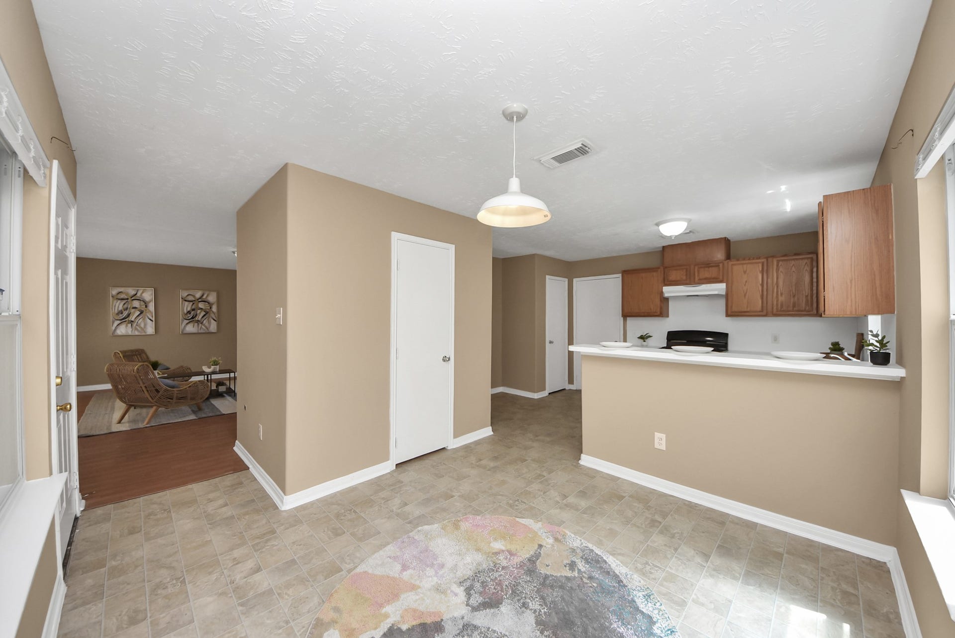 3006 Palace Oaks Drive, Houston, TX 77082 This view looks into the breakfast nook, which also features a convenient peninsula with additional seating. The door across the room leads to the half bathroom.