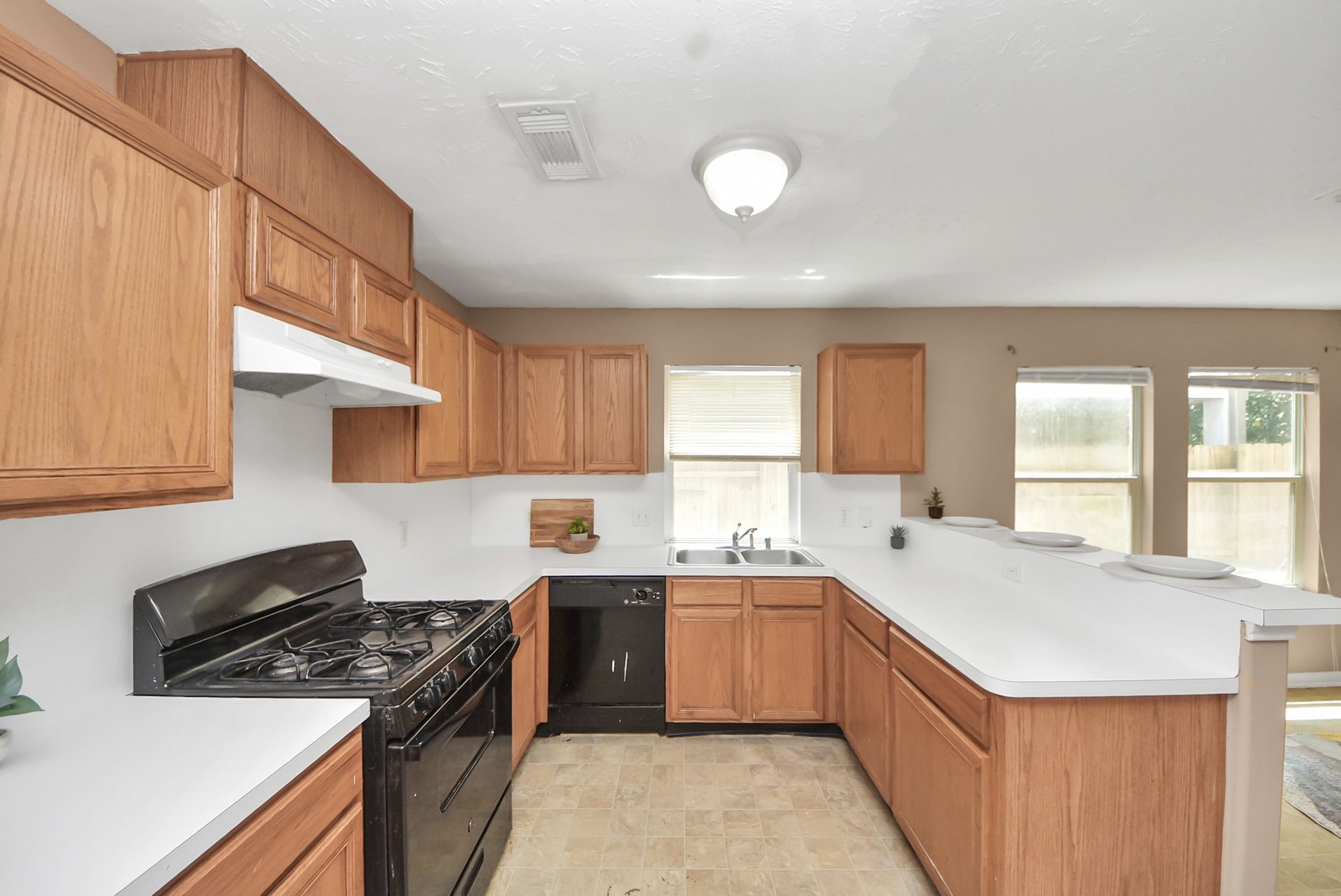 3006 Palace Oaks Drive, Houston, TX 77082 The kitchen offers a good amount of counter space and storage, plus a convenient pantry located just behind this view.