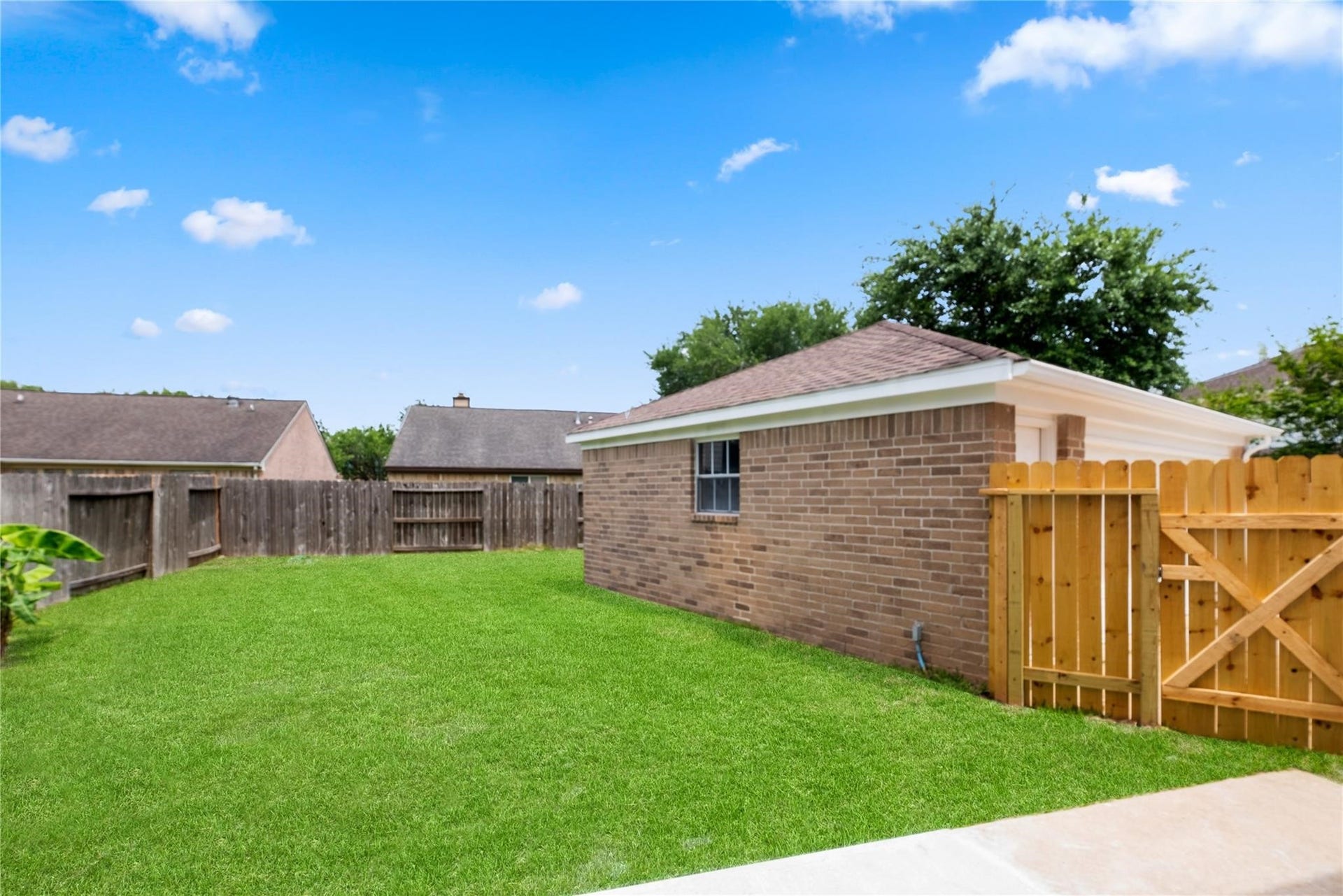 4523 Waterfall Way, Sugar Land, TX 77479 The spacious backyard offers plenty of room for outdoor activities, entertaining, or simply relaxing in your own private outdoor space.