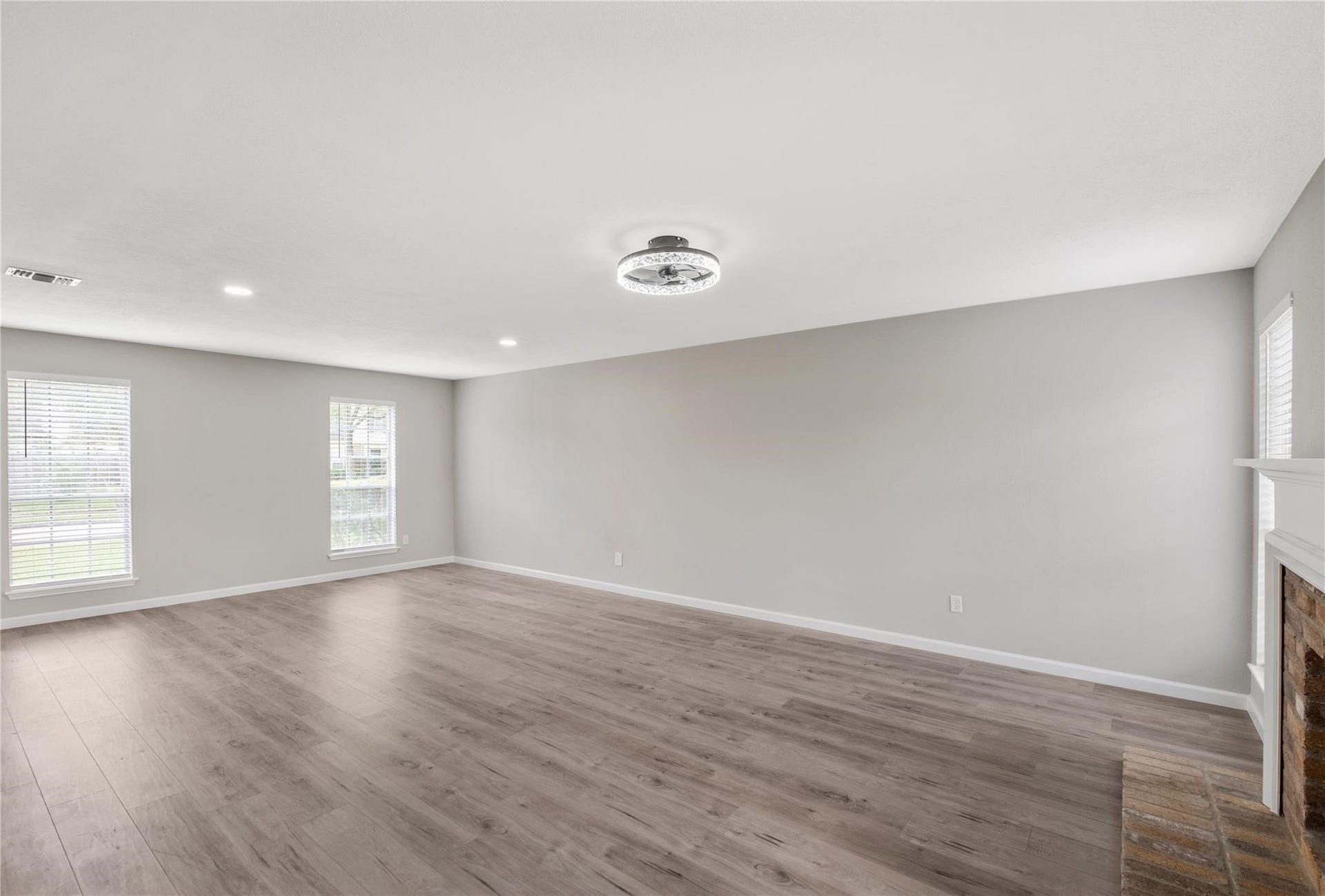 4523 Waterfall Way, Sugar Land, TX 77479 The spacious living area offers plenty of room for gathering and entertaining, with updated flooring and abundant natural light throughout.