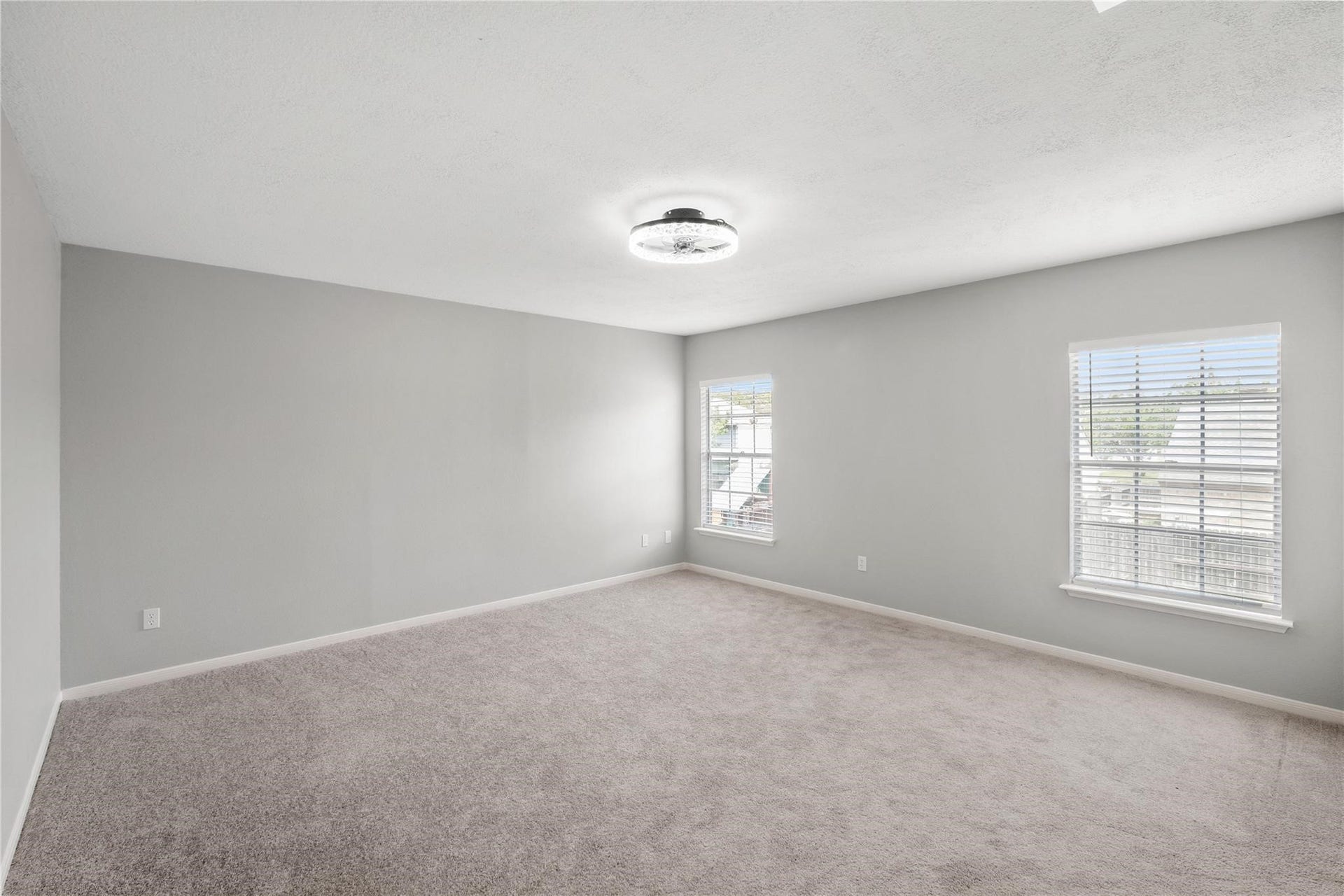 4523 Waterfall Way, Sugar Land, TX 77479 The spacious upstairs primary bedroom offers plenty of room to create your own private retreat, complete with large windows that fill the space with natural light.
