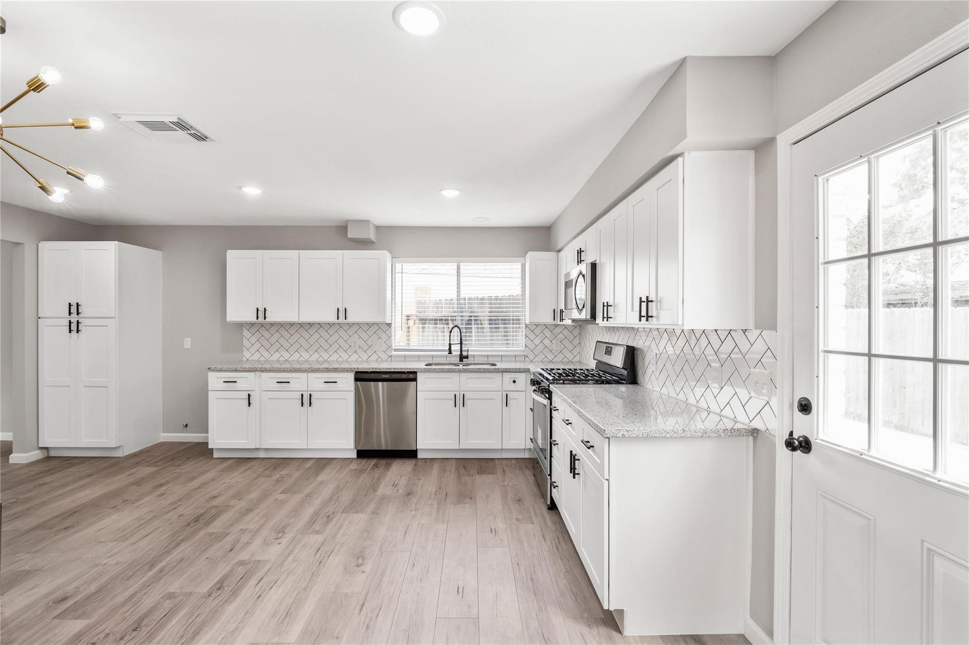 4523 Waterfall Way, Sugar Land, TX 77479 The kitchen has been completely transformed with stylish updates throughout.