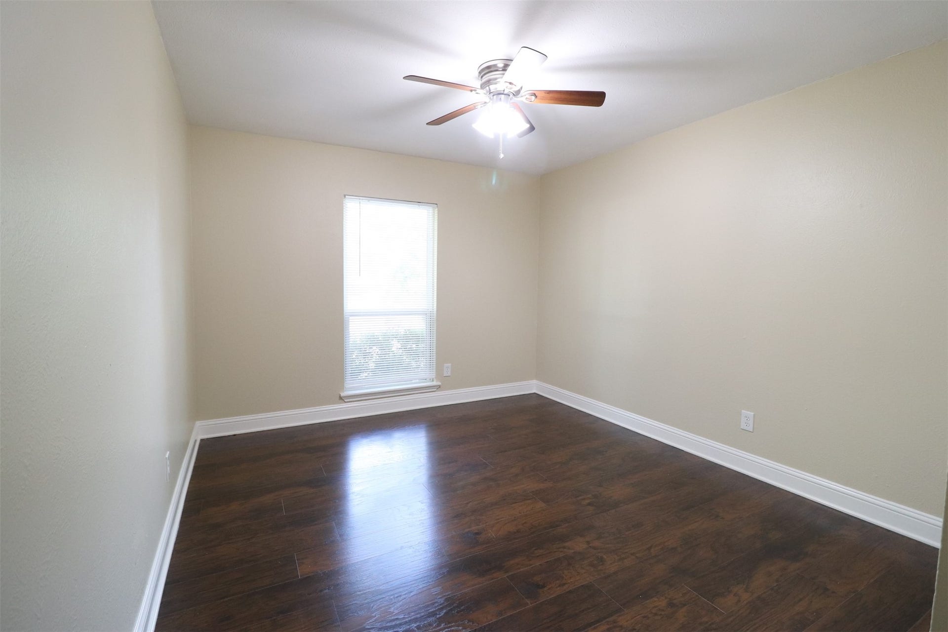 2nd bedroom overlooking the front yard.