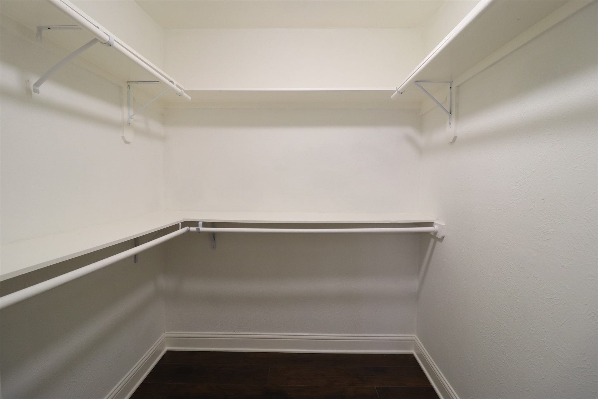 Primary bedroom walk-in closet.