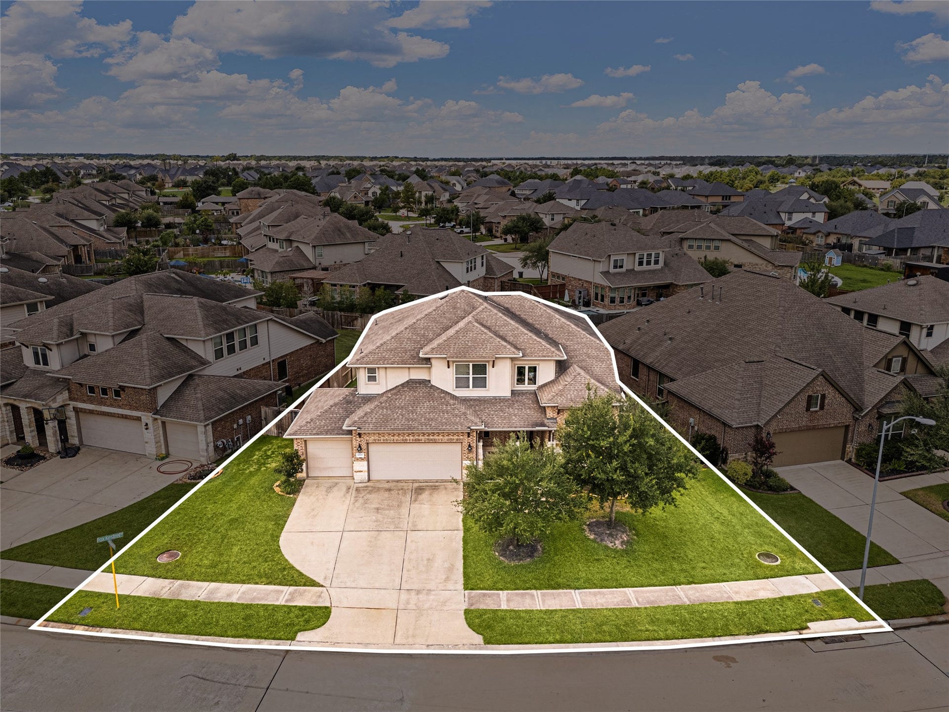 18707 Fox Kestrel Trail, Cypress, TX 77429 Spacious two-story home with a well-maintained lawn, three-car garage, and charming curb appeal, nestled in a friendly neighborhood.