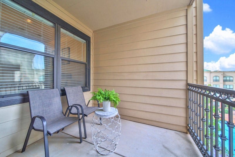 2299 Lone Star Drive, #406, Sugar Land, TX 77479 ENJOY The views form the ample balcony, where you can overlook the courtyard and OASIS-STYLE Sparkling pool.