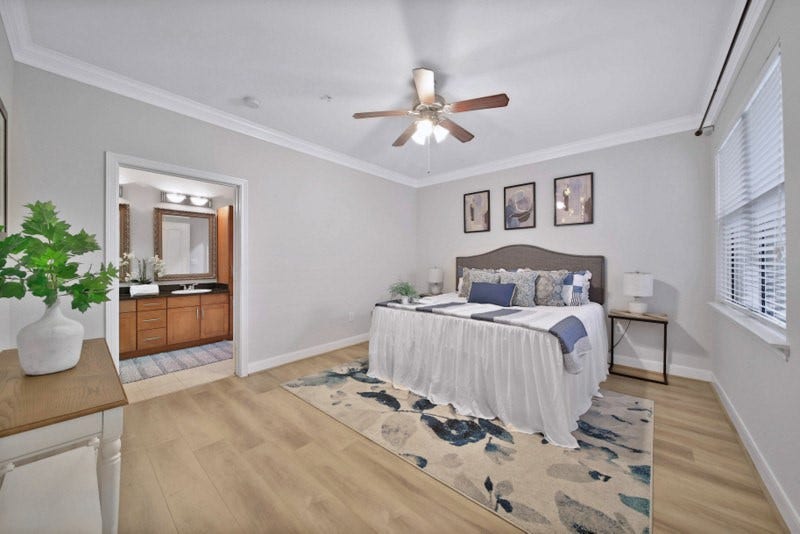 2299 Lone Star Drive, #406, Sugar Land, TX 77479 The view of large primary suite W/New wood floor, crown molding and ceiling fan.