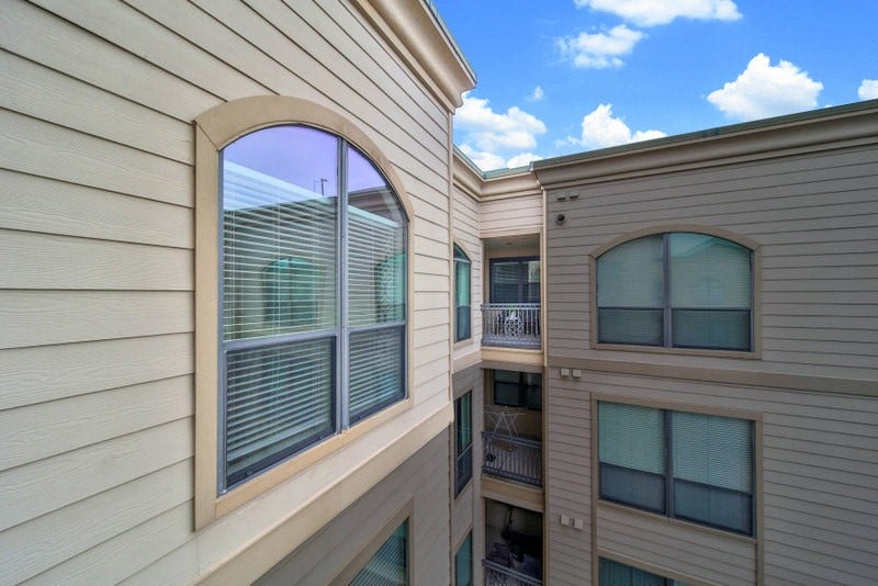 2299 Lone Star Drive, #406, Sugar Land, TX 77479 The view of exterior of unit 406 and its' balcony.