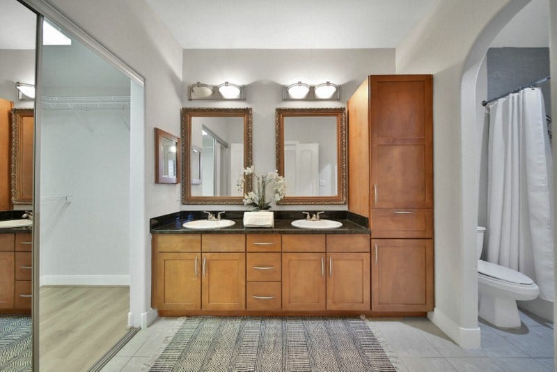 2299 Lone Star Drive, #406, Sugar Land, TX 77479 The view of En-suite primary bath W/Double sinks, granite counter-tops.