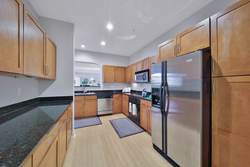 2299 Lone Star Drive, #406, Sugar Land, TX 77479 The view of kitchen W/Ample countertops and cabinetries.