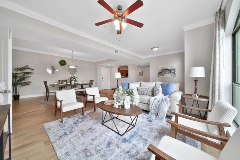 2299 Lone Star Drive, #406, Sugar Land, TX 77479 The view of spacious living room W/New wood flooring, crown molding, ceiling fan. The Luxury 2/2 Condo is located in Sugar Land Town Square.