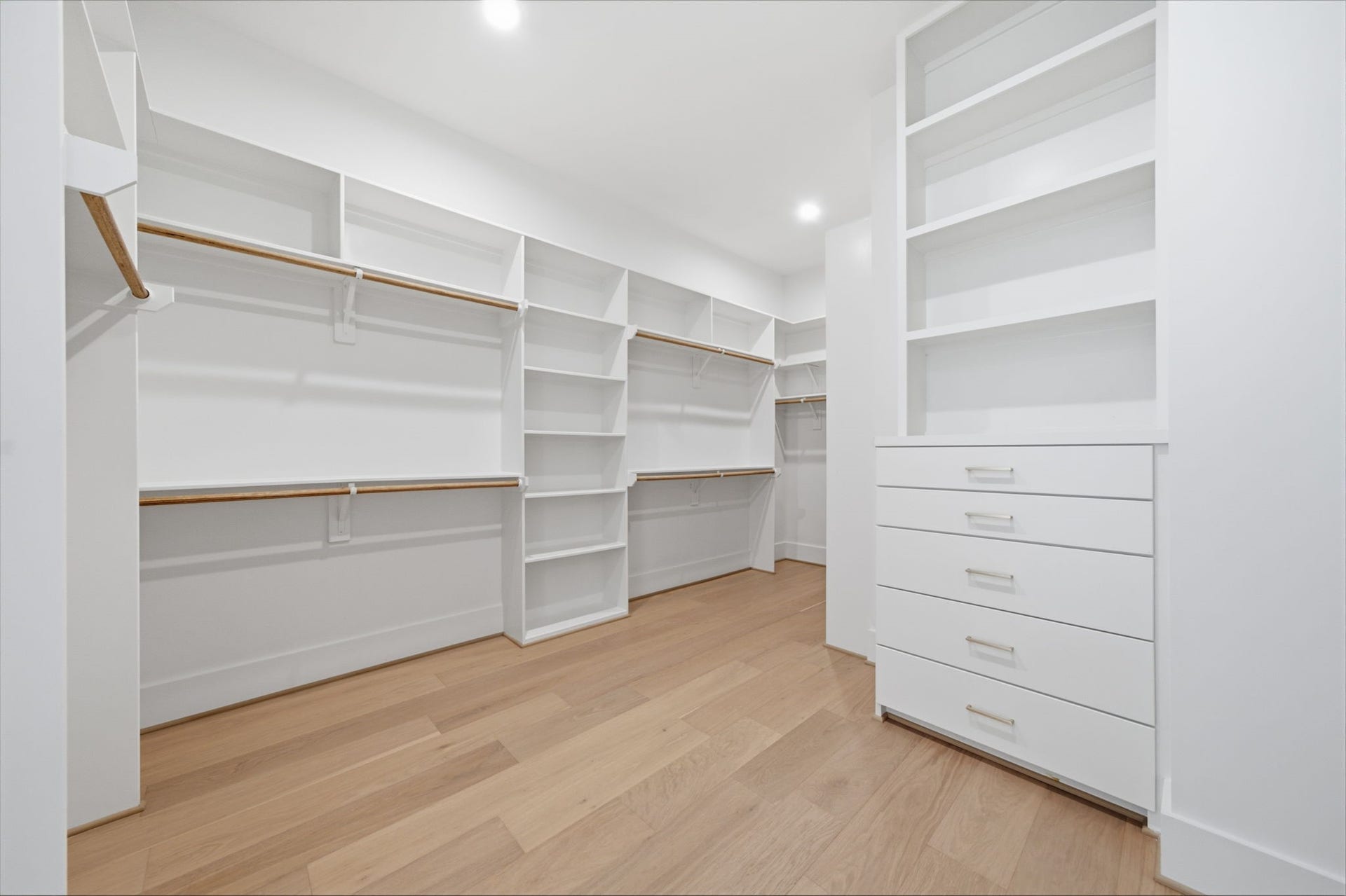 835 W 25th Street, Houston, TX 77008 Perfectly thought out built ins in this massive primary closet. One of two closets in this room