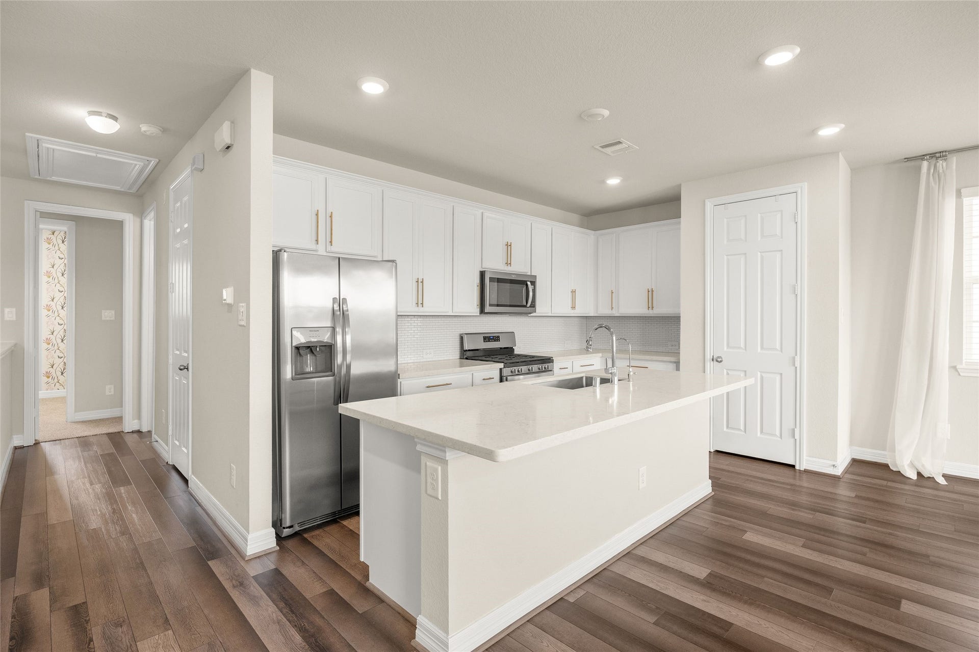 18223 Crystal Knoll Drive, Cypress, TX 77433 Plenty of cabinet storage keeps everyday necessities tucked away while maintaining a clean, uncluttered look.