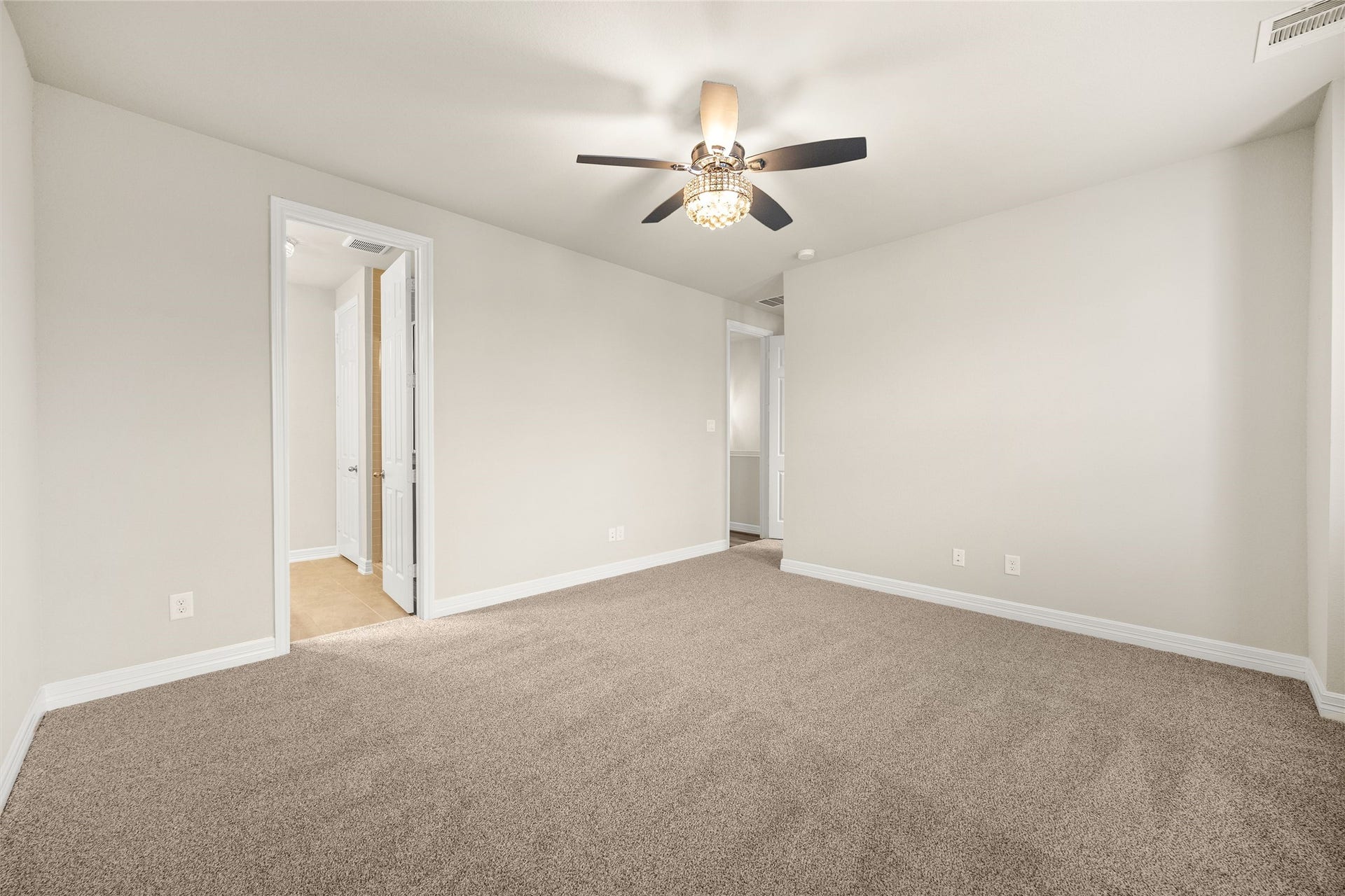 18223 Crystal Knoll Drive, Cypress, TX 77433 Multiple windows bring natural light into the room, while generous wall space gives you plenty of freedom with furniture placement.