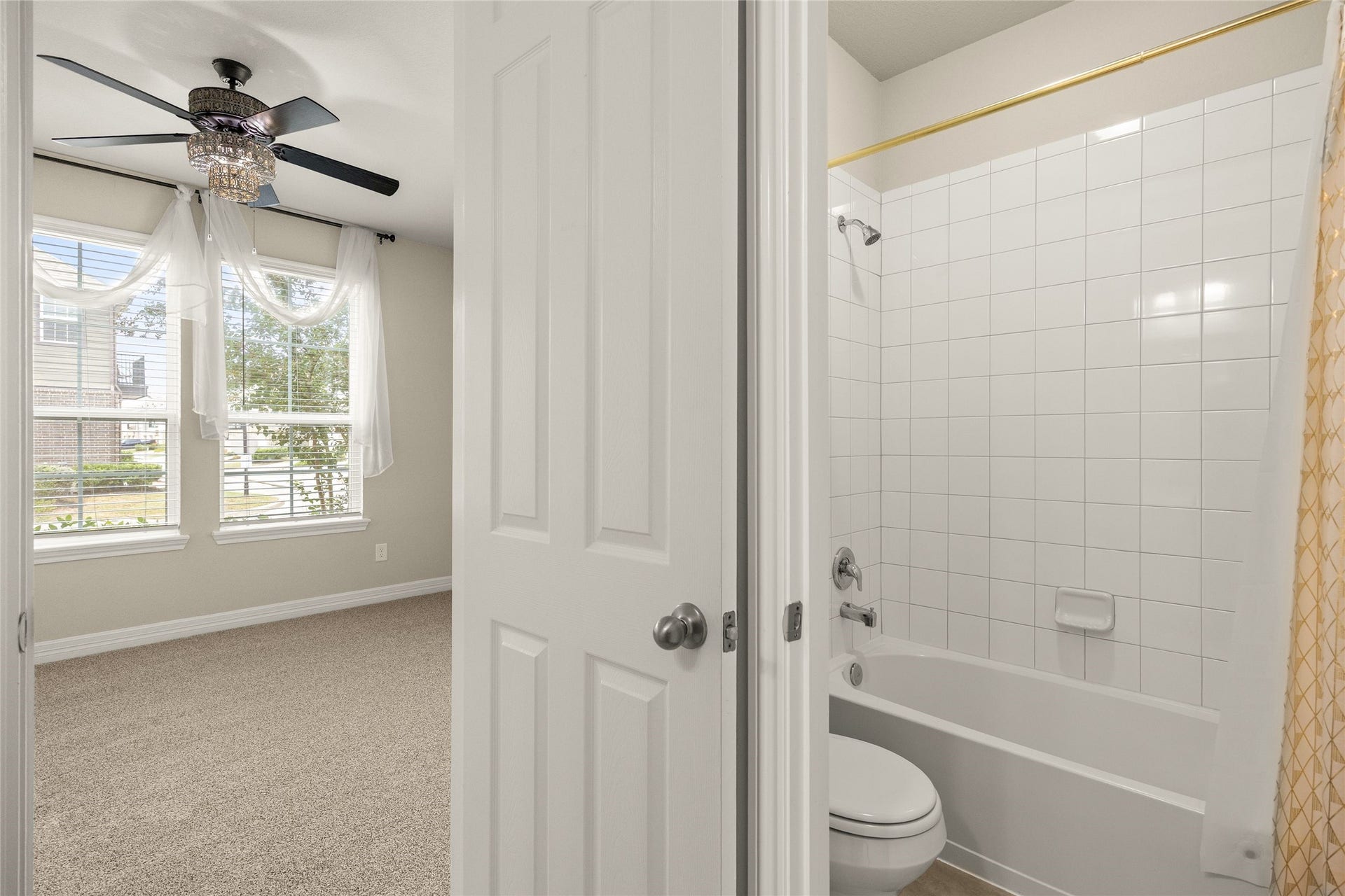 18223 Crystal Knoll Drive, Cypress, TX 77433 A full bathroom on the first floor is conveniently positioned near both secondary bedrooms, creating a functional setup for family or overnight guests.
