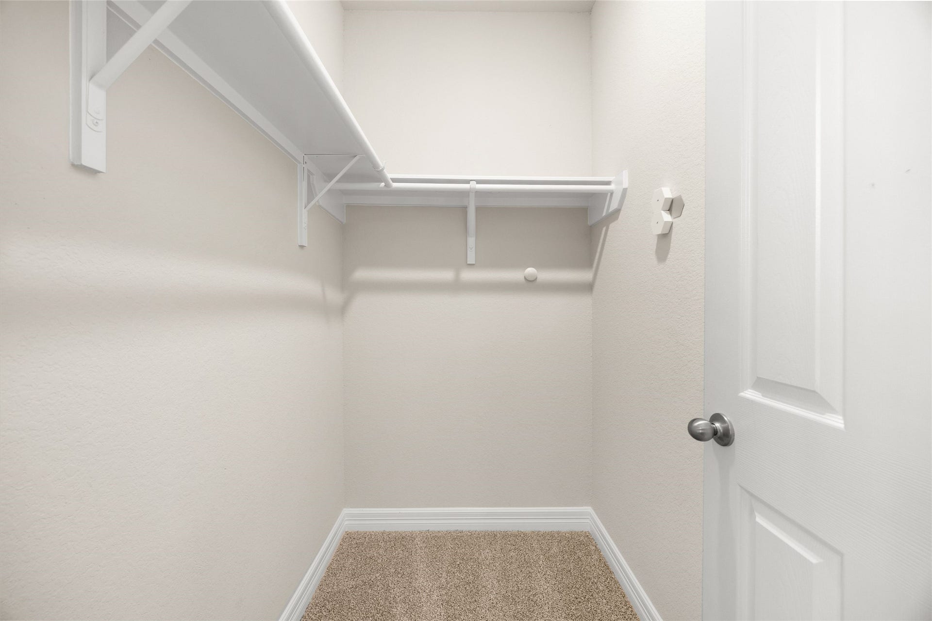 18223 Crystal Knoll Drive, Cypress, TX 77433 Hanging space runs along multiple walls, giving you plenty of room for clothing, shoes, and additional storage pieces.