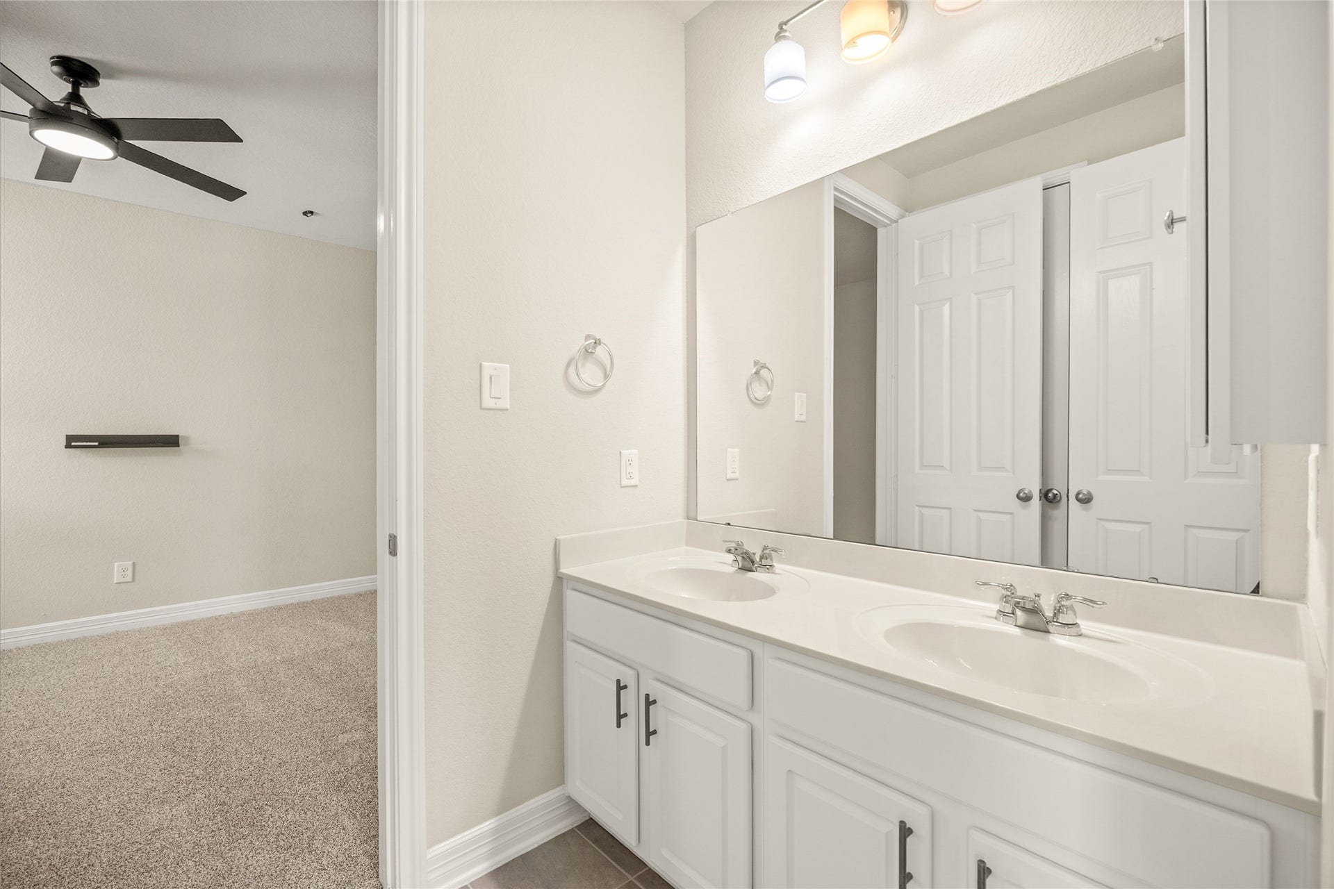 18223 Crystal Knoll Drive, Cypress, TX 77433 Thoughtfully located away from the main living level, this bath helps give the downstairs bedrooms their own comfortable space.