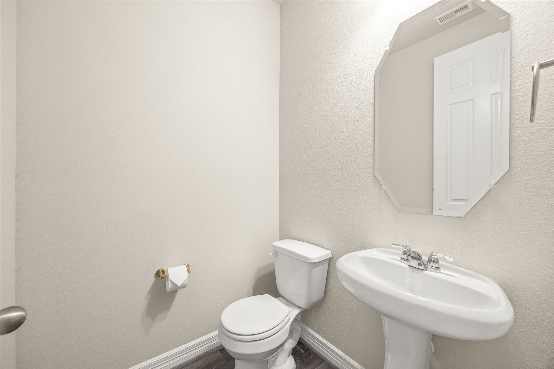 18223 Crystal Knoll Drive, Cypress, TX 77433 A convenient half bath keeps things simple and polished with a pedestal sink, neutral finishes, and easy access for guests.