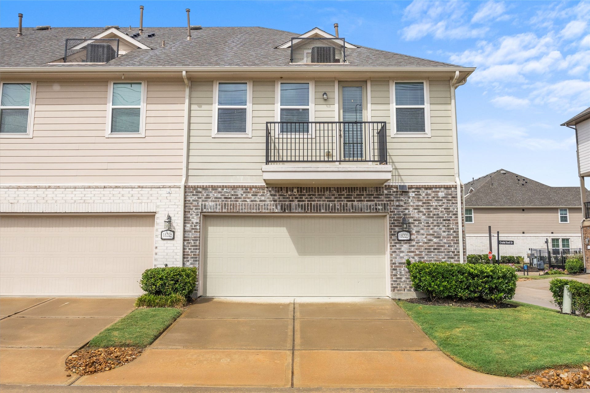18223 Crystal Knoll Drive, Cypress, TX 77433 Black metal railing gives the balcony a clean look and creates an outdoor spot for a chair, morning coffee, or a little fresh air.