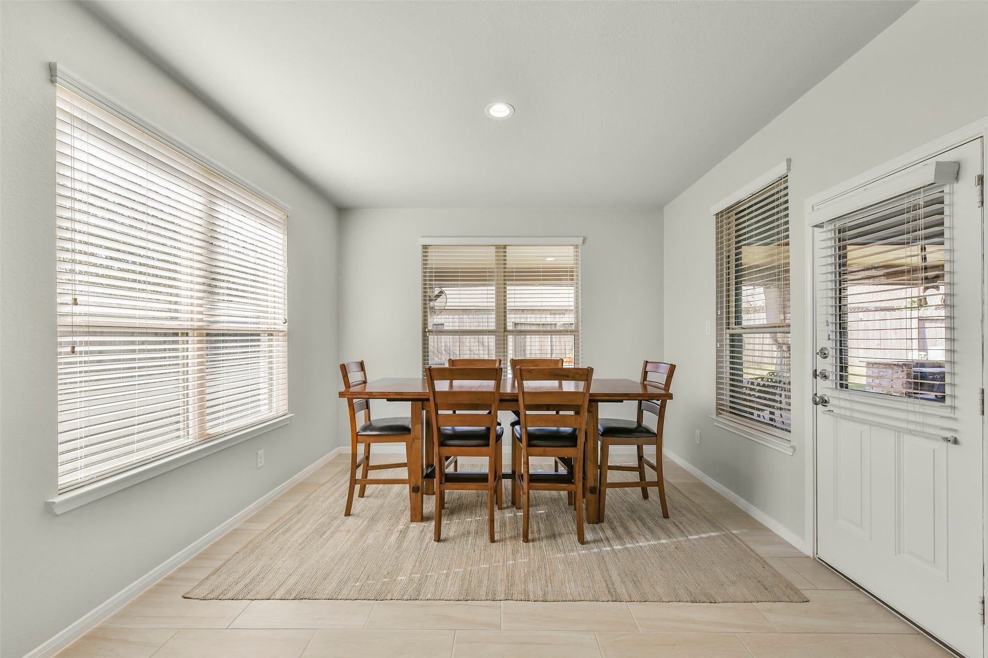 18015 Svensson Slade Lane, Houston, TX 77044 Large breakfast area/ dining room with tile floors opens to back patio