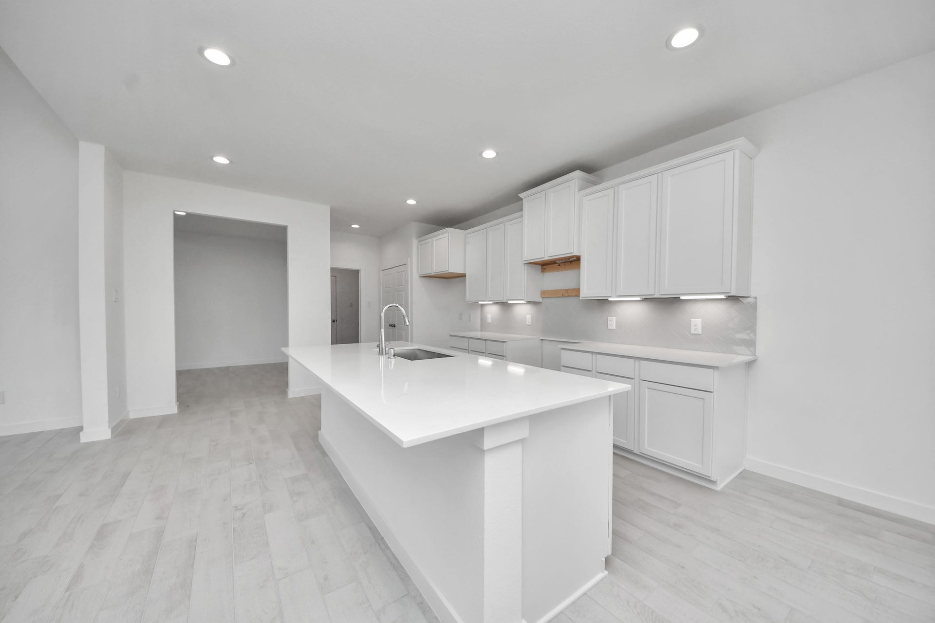 3064 Spoolwood Trail, Magnolia, TX 77355 The open concept effortlessly connects the kitchen to the expansive family room, forming a perfect hub for gatherings. This seamless flow creates an inviting space where cooking and socializing come together harmoniously.