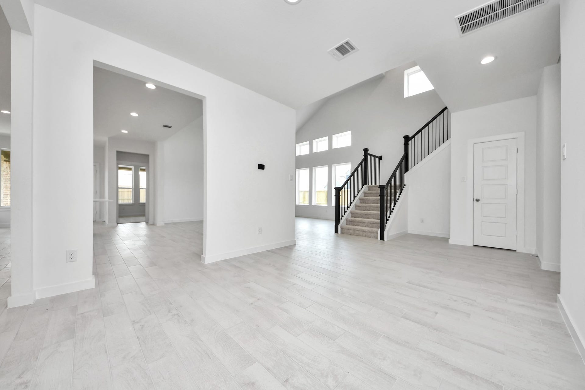 3064 Spoolwood Trail, Magnolia, TX 77355 Create lasting memories with your family and friends at the dining table! This expansive dining room showcases sophisticated flooring, custom paint, and seamlessly connects to the family room and kitchen, providing an open and inviting atmosphere