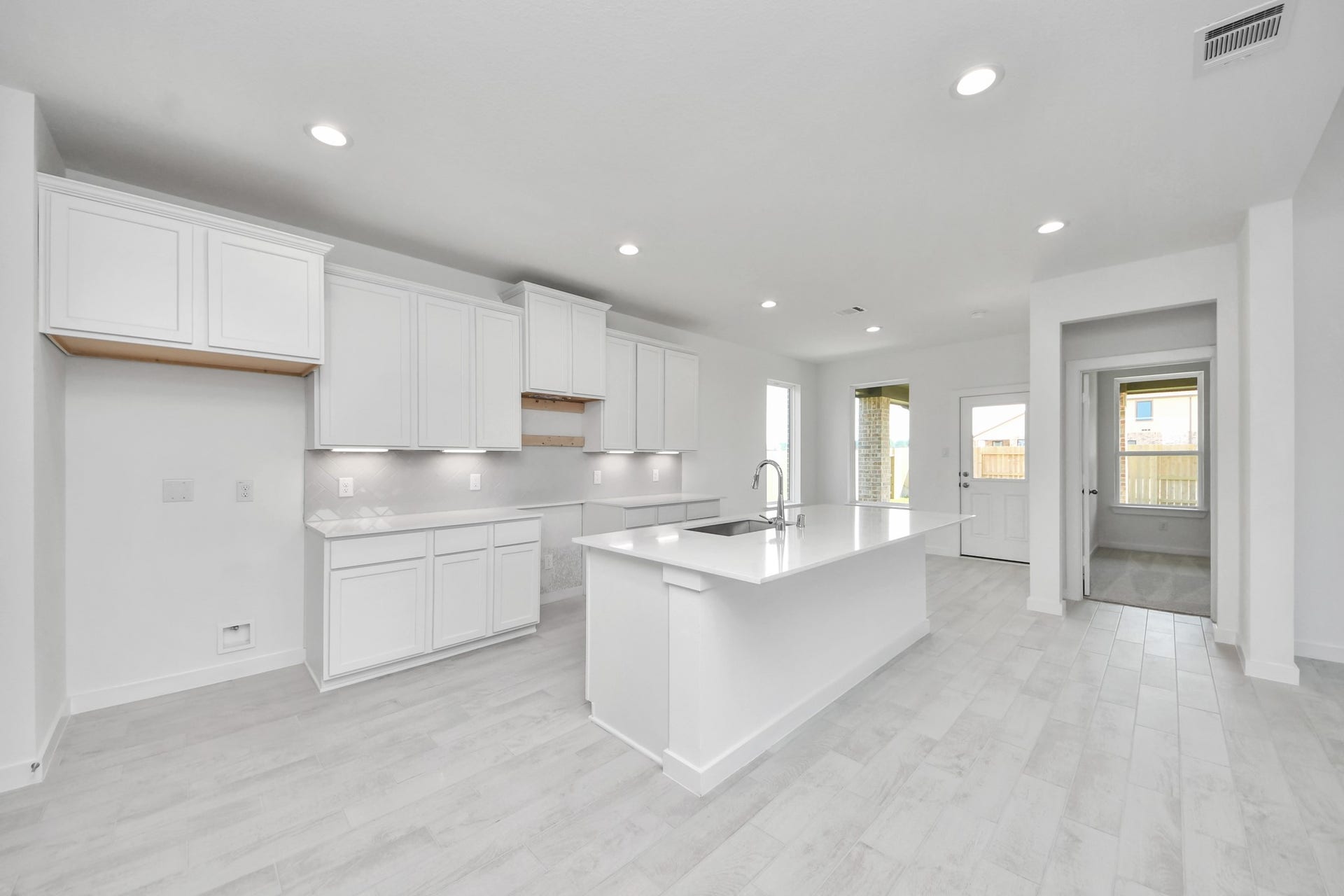 3064 Spoolwood Trail, Magnolia, TX 77355 The extended counter area adds both practicality and style, making meal preparation a breeze. Every detail is thoughtfully designed to enhance the kitchen's functionality and aesthetic appeal.