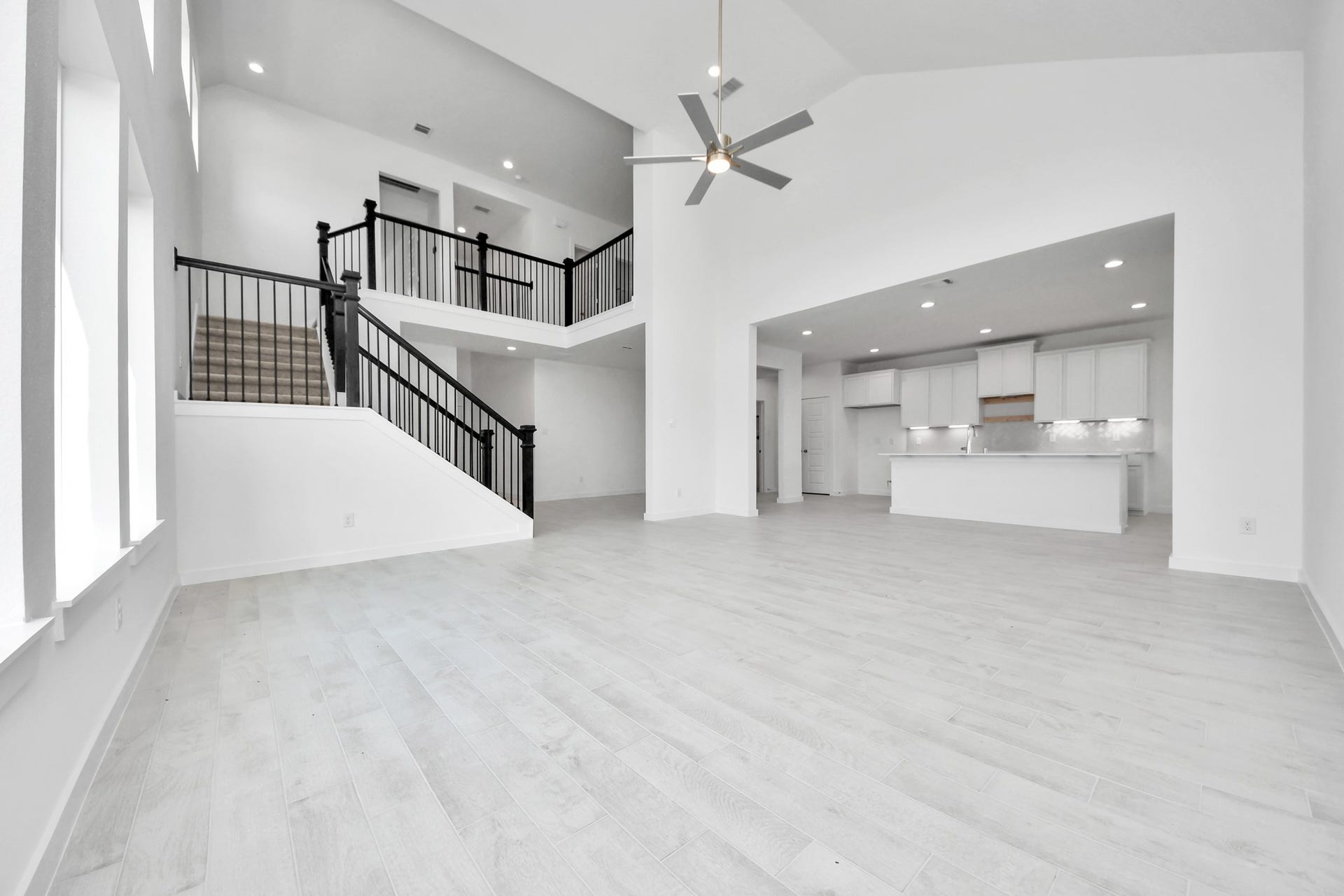 3064 Spoolwood Trail, Magnolia, TX 77355 Gather the family and guests together in your lovely living room! Featuring soaring high ceilings, recessed lighting, ceiling fan, custom paint, gorgeous floors, and large windows that provide plenty of natural lighting throughout the day.