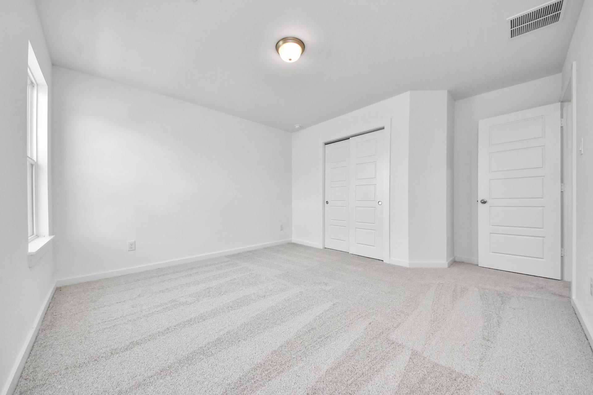 3064 Spoolwood Trail, Magnolia, TX 77355 Generously sized secondary bedrooms featuring spacious closets, soft and inviting carpeting underfoot, large windows allowing plenty of natural light, and the added touch of privacy blinds for your personal retreat.