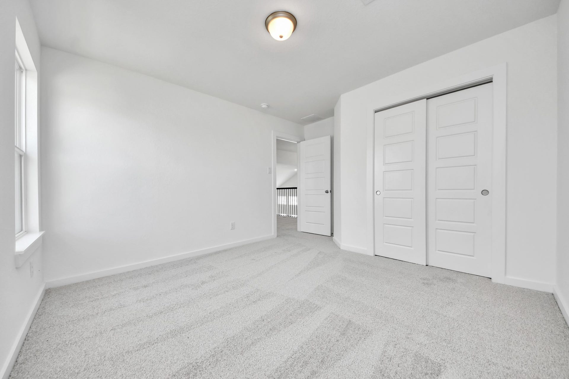 3064 Spoolwood Trail, Magnolia, TX 77355 Generously sized secondary bedrooms featuring spacious closets, soft and inviting carpeting underfoot, large windows allowing plenty of natural light, and the added touch of privacy blinds for your personal retreat.