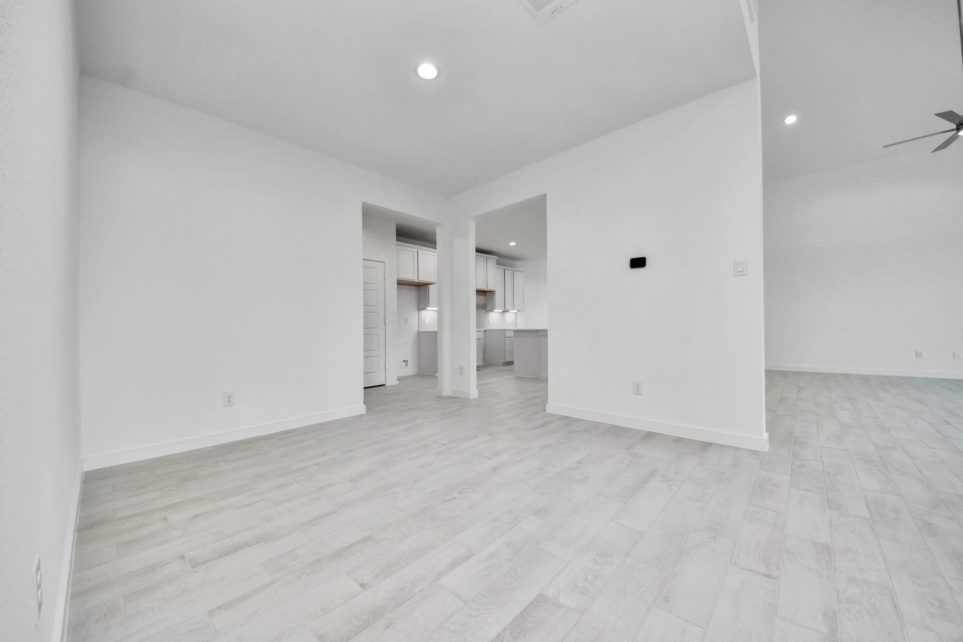 3064 Spoolwood Trail, Magnolia, TX 77355 Make memories gathered around the table with your family and friends! This spacious dining room features elegant flooring, custom paint, and adjacent to family room and kitchen for open concept feel.