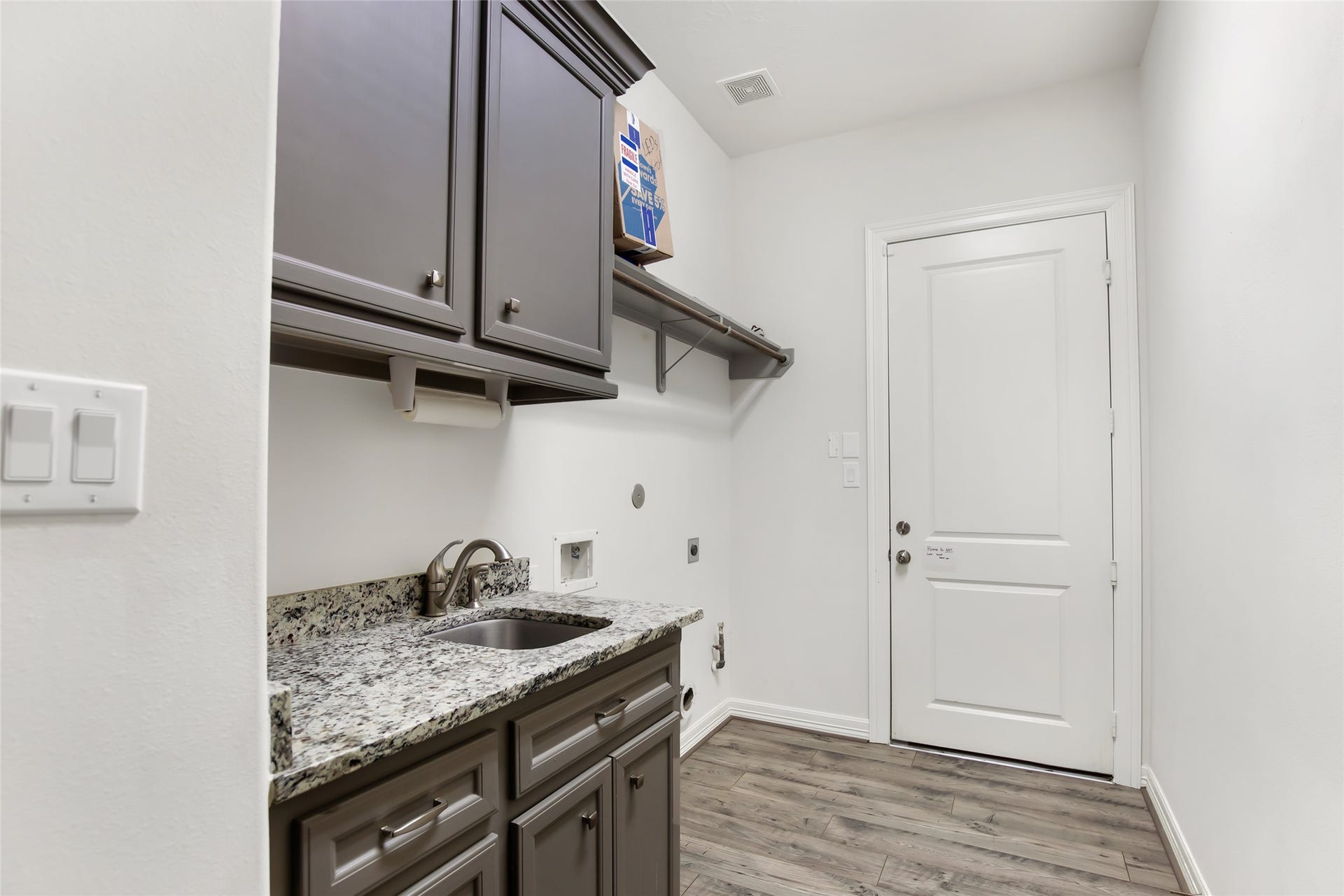 538 Magnolia Point Drive, Huffman, TX 77336 Laundry room with sink and additional storage