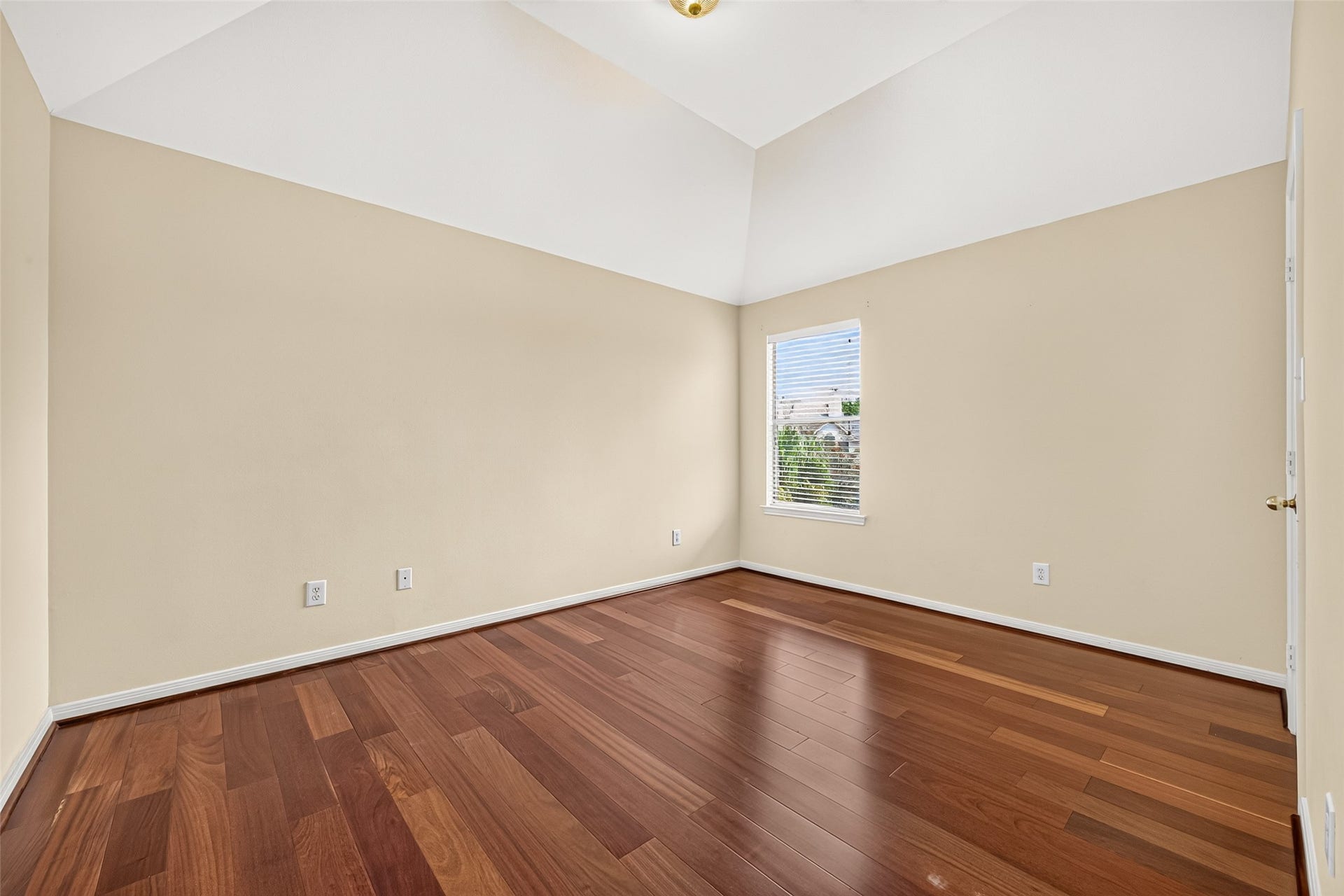 1711 Emma Cove Court, Sugar Land, TX 77479 Another secondary bedroom features polished wood flooring, high ceilings, and abundant wall space for furnishings.