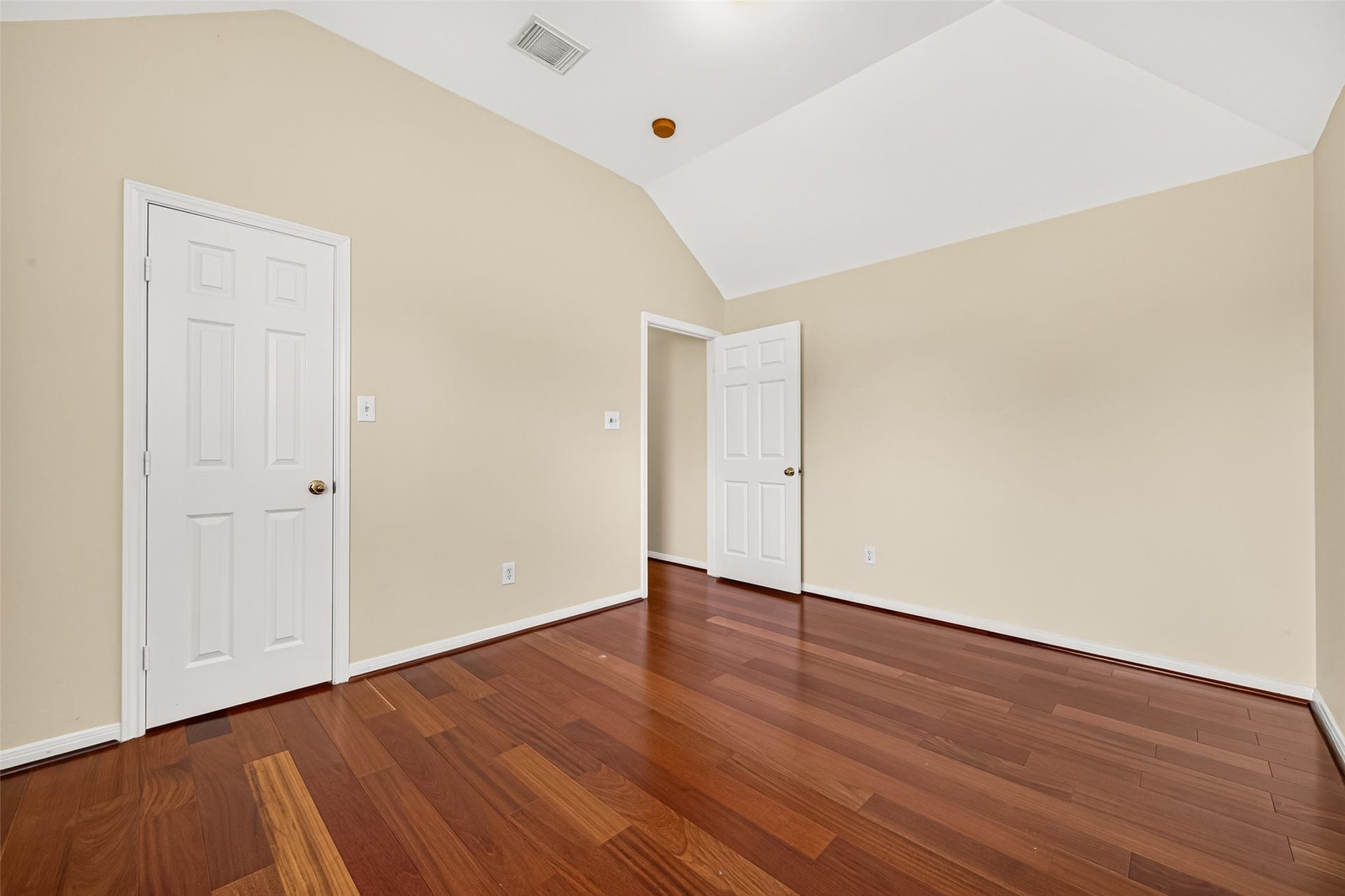 1711 Emma Cove Court, Sugar Land, TX 77479 This alternate view highlights the rooms warm finishes, angled ceiling, and dedicated closet.