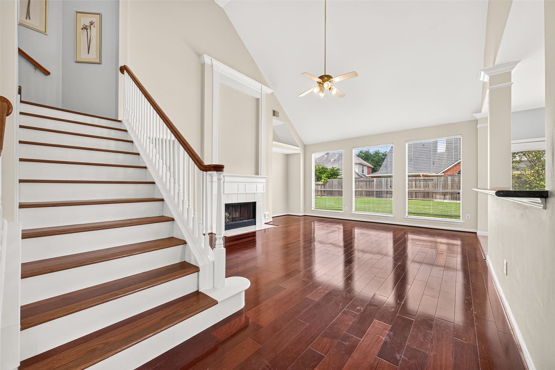 1711 Emma Cove Court, Sugar Land, TX 77479 Wood-trimmed staircase overlooks the main living area, adding architectural interest and a graceful transition to the second floor.