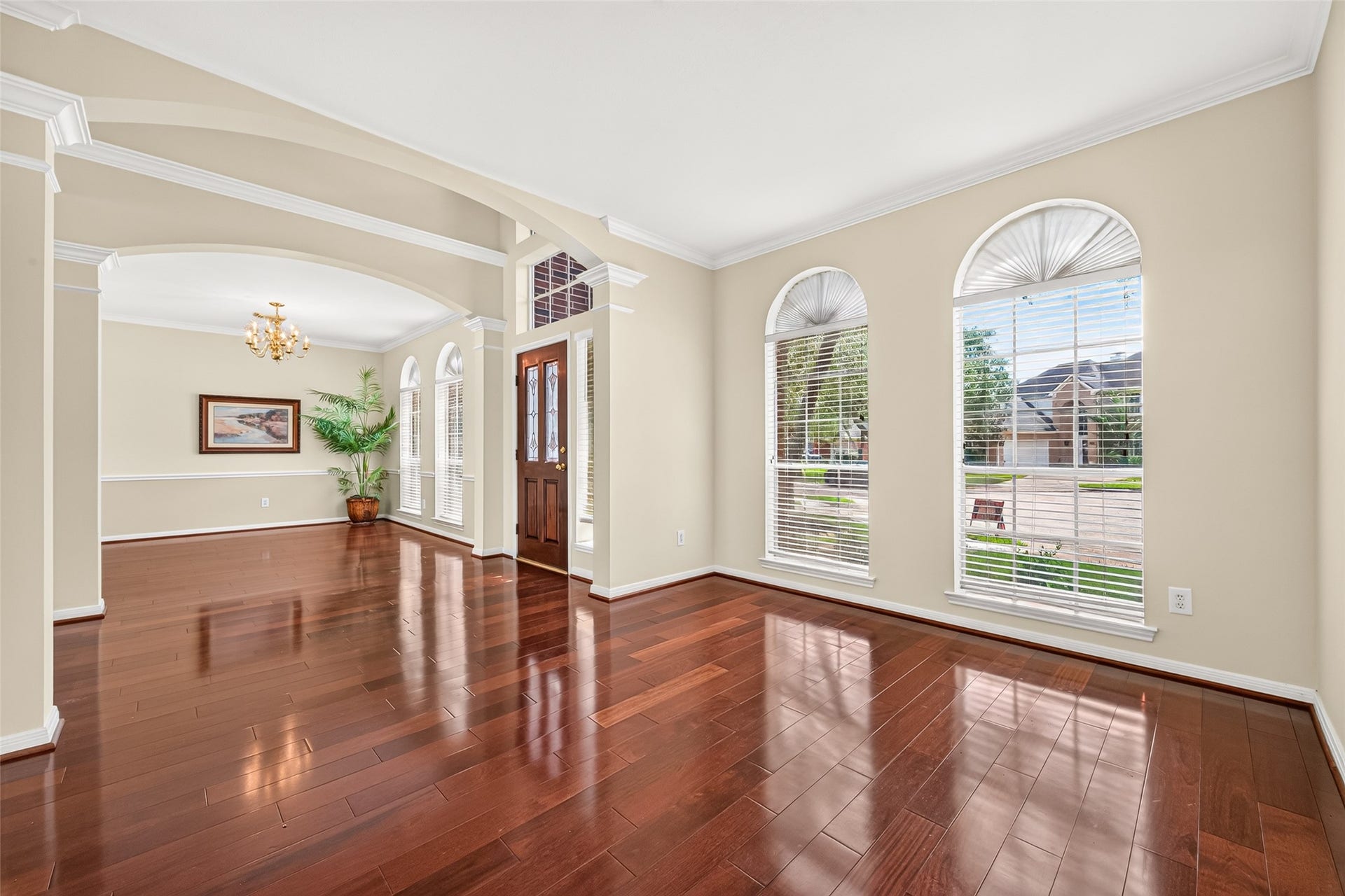 1711 Emma Cove Court, Sugar Land, TX 77479 Graceful architectural openings connect the front living and dining areas while maintaining clearly defined spaces.