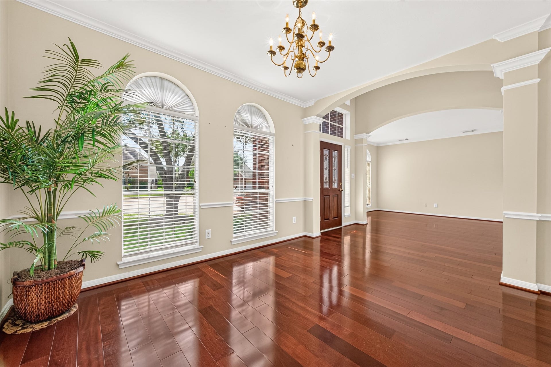 1711 Emma Cove Court, Sugar Land, TX 77479 Two arched windows bring natural light into the dining area and complement its traditional design.